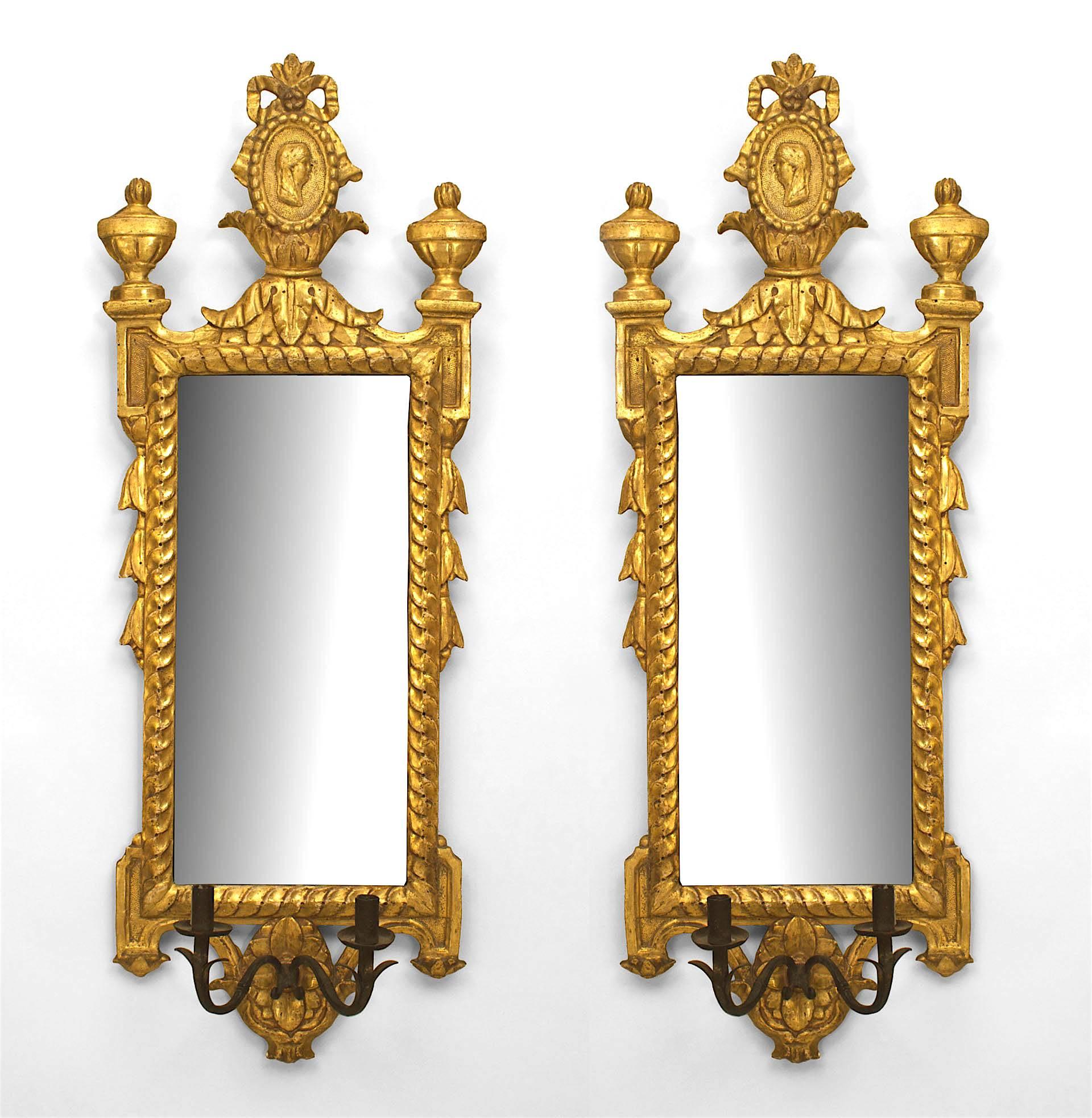 Pair of Italian Neoclassic (18th/19th Century) giltwood wall mirrors / girandoles with two wrought iron arms with lights at the bottoms. (PRICED AS Pair)
