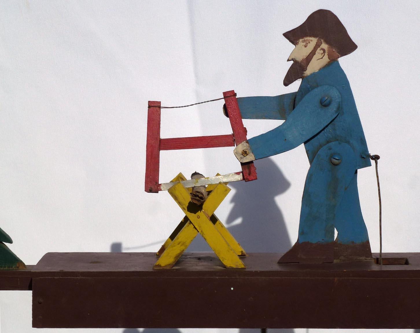 American Nicely Painted Whirligig of a Bearded Man Sawing Wood, 2nd Half 20th Century For Sale