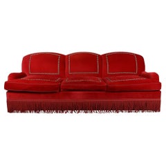A Nick Olsen Red-Velvet Three-Seater Bridgewater Sofa