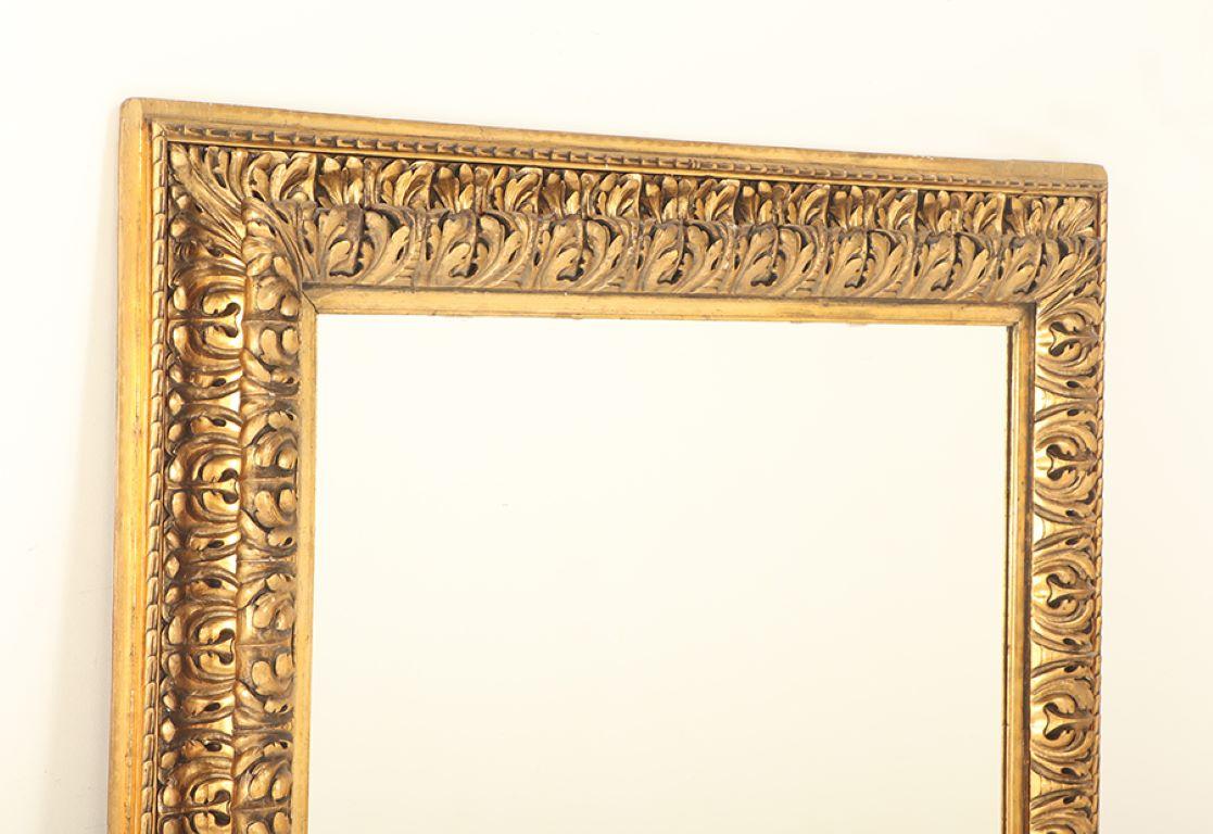 19th Century A Nineteenth Century continental relief and gilt carved mirror. For Sale