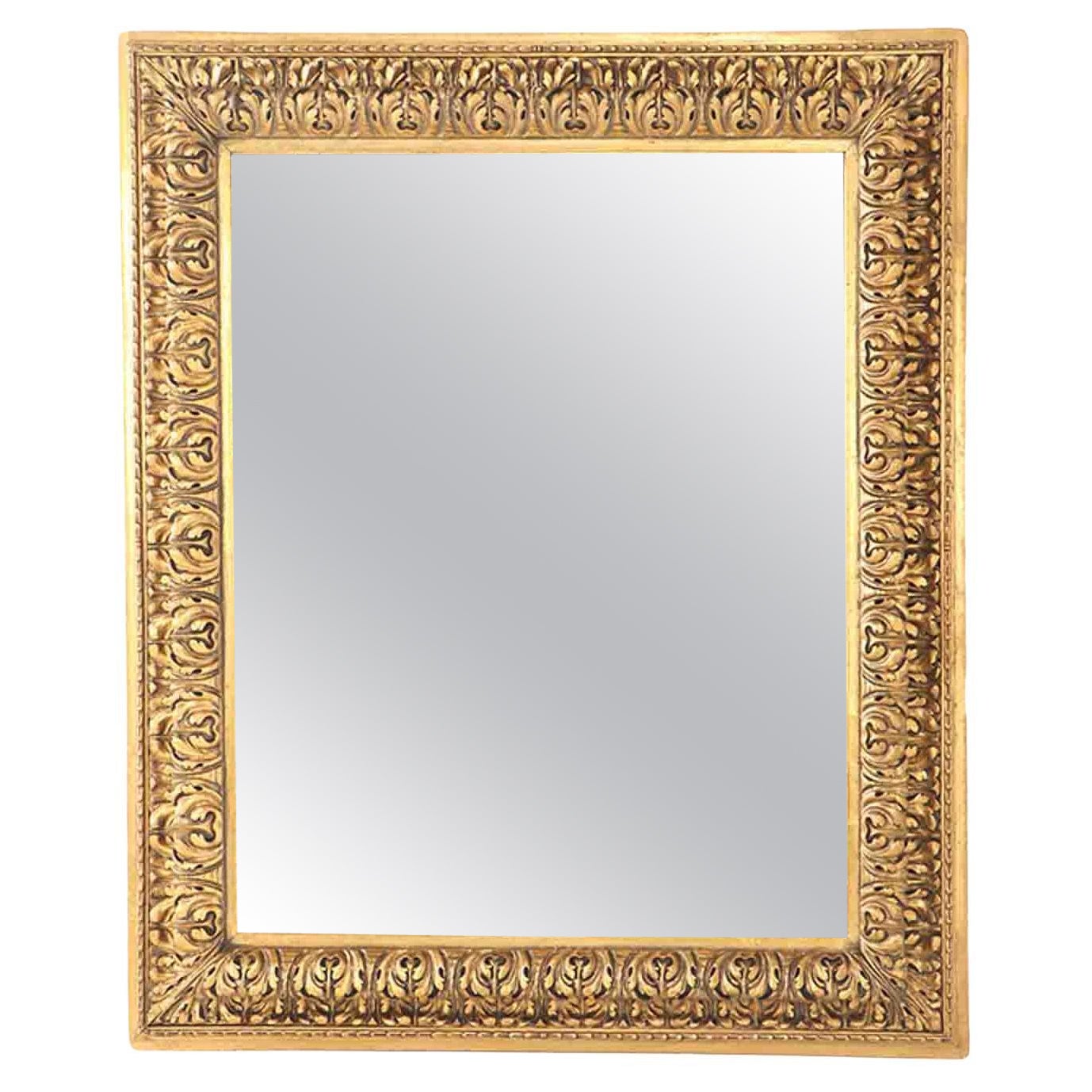 A Nineteenth Century continental relief and gilt carved mirror.