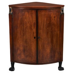 A Nineteenth Century Empire Corner Cupboard 