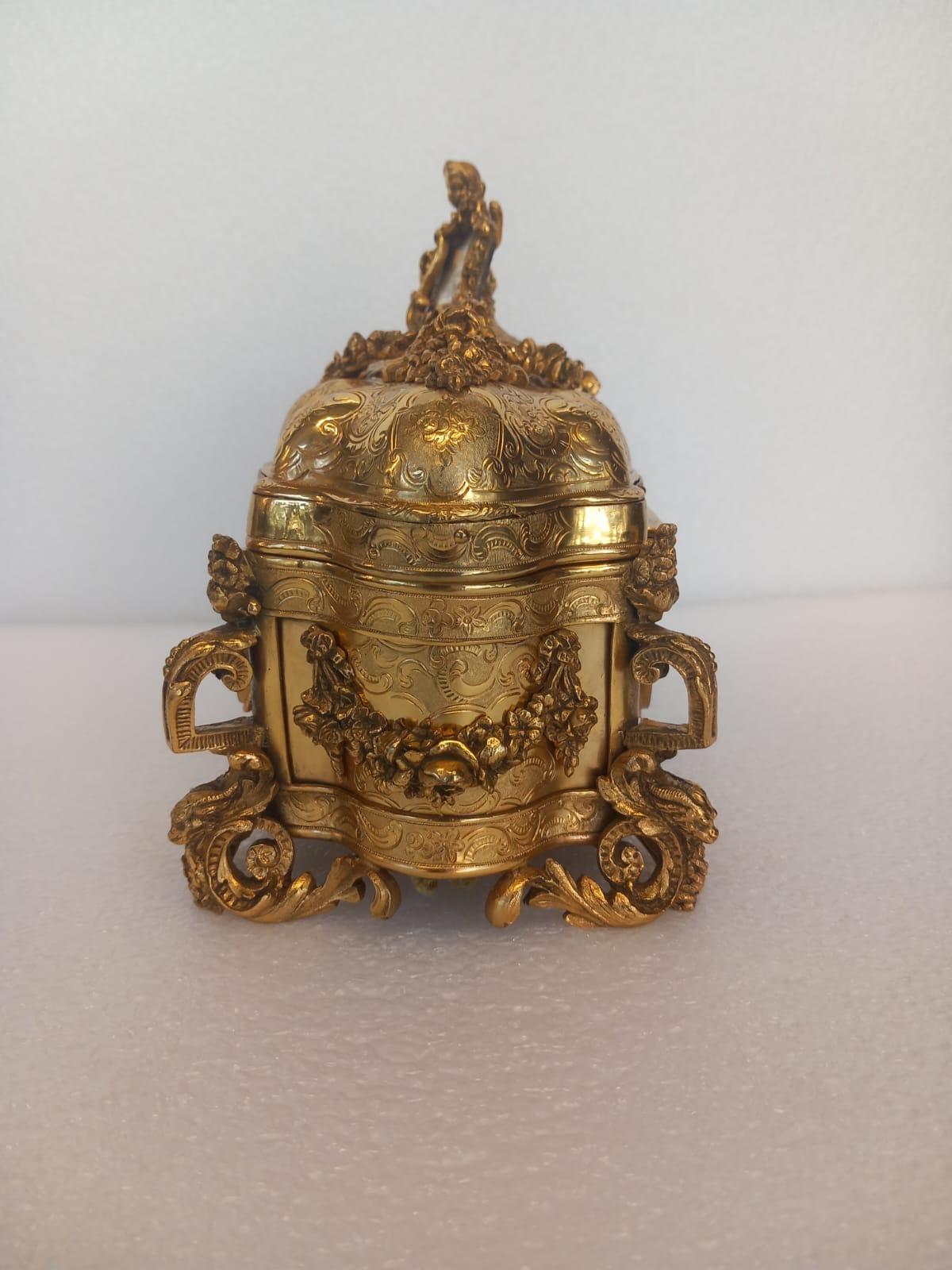 19th Century A nineteenth century French ormolu casket, in the medieval style, with a cherub For Sale