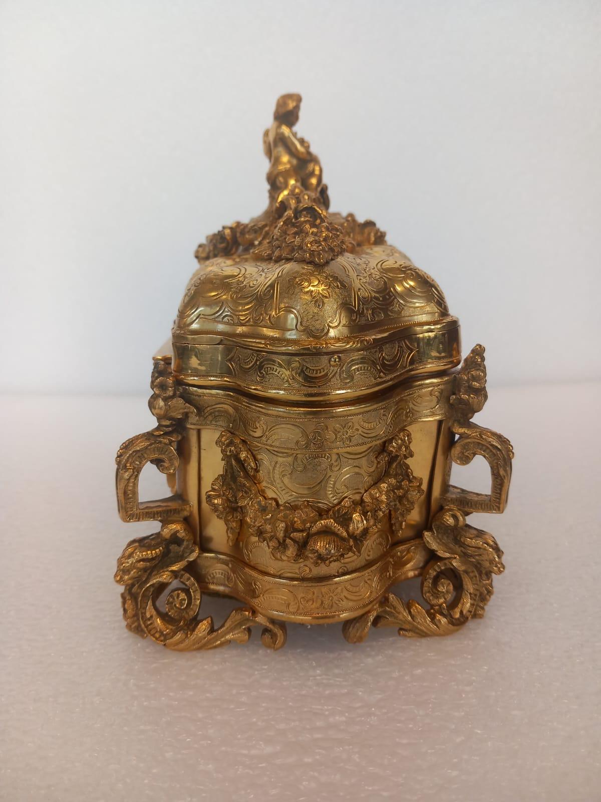 A nineteenth century French ormolu casket, in the medieval style, with a cherub For Sale 1