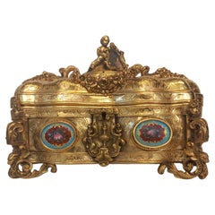 A nineteenth century French ormolu casket, in the medieval style, with a cherub