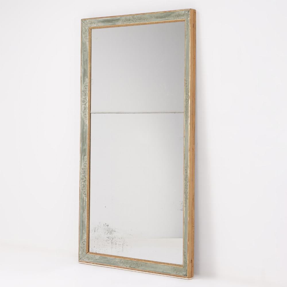 Nineteenth century French painted and gilt mirror. This size is very desirable and the frame has been painted a very pretty pale green that resembles an exterior bronze color.