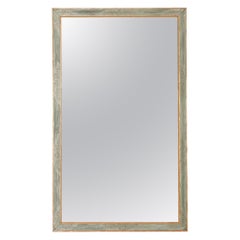 A Nineteenth century French painted and gilt mirror.