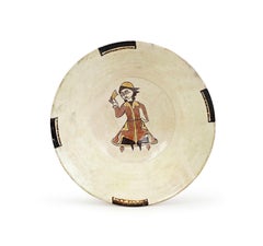A Nishapur Slip-Painted Pottery Bowl Depicting A Seated Figure, 10TH Century