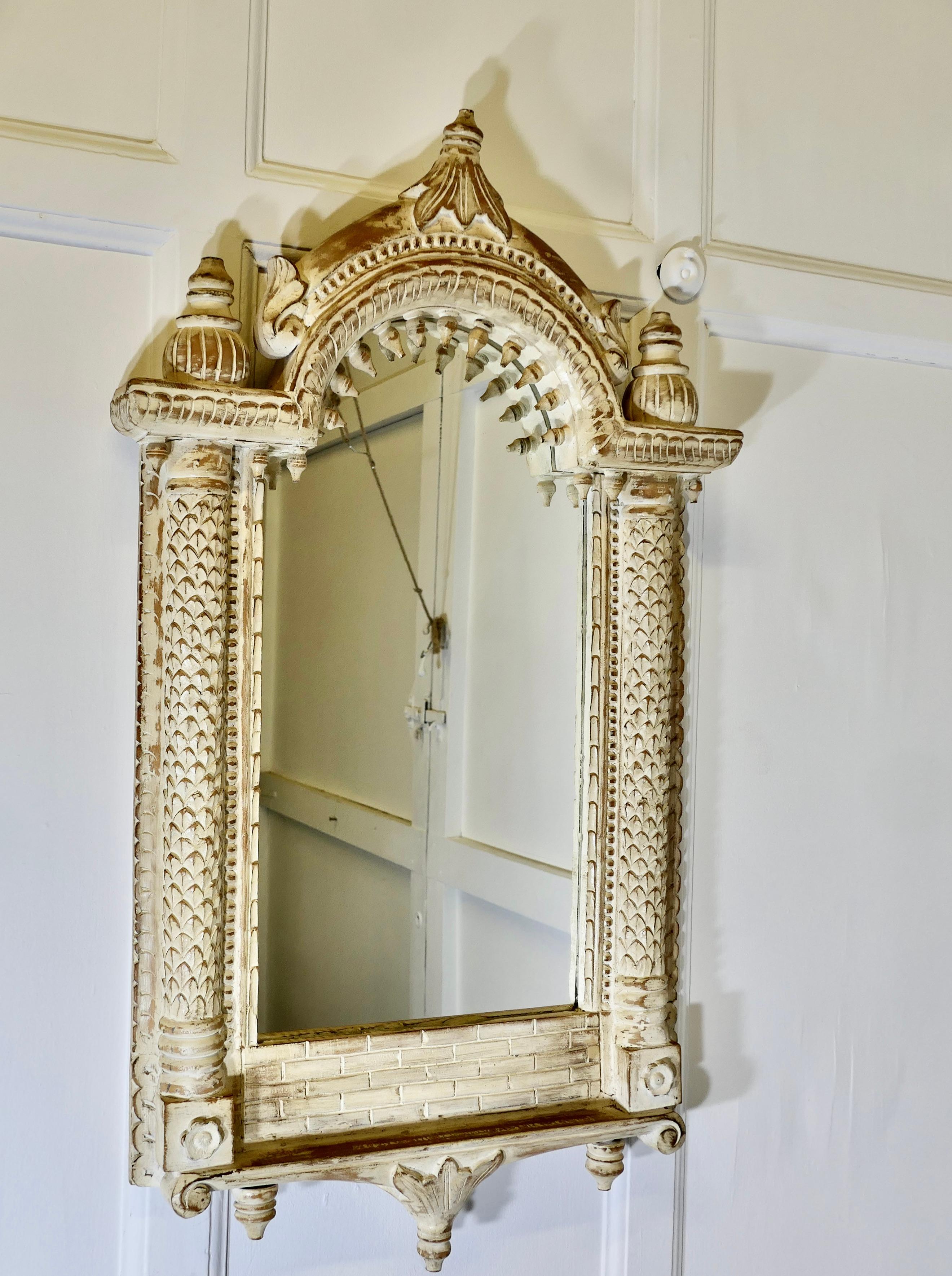 A North African Painted Tall Arched Wall Mirror

A lovely piece, the 4” wide frame is beautifully carved with columns and turnings, it has been finished in a cream wash picking out the detail of the carving which gives it a look as though it is made