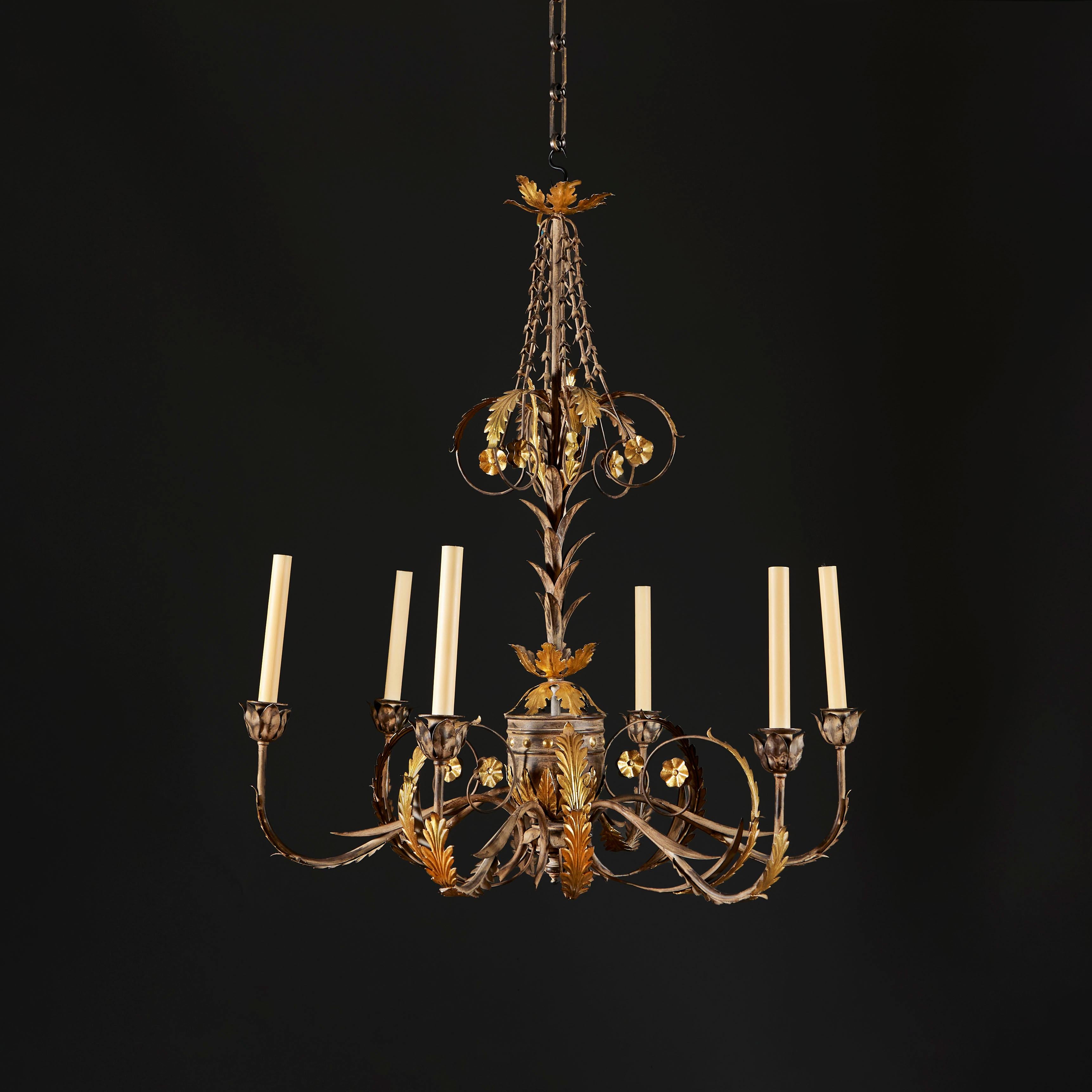 Italy, circa 1890

A fine late nineteenth century painted tole chandelier of six arms with gilded foliate elements, central urn and flower husks, now electrified for electricity. 

Height  95.00cm

Diameter  75.00cm

Chain available upon request.