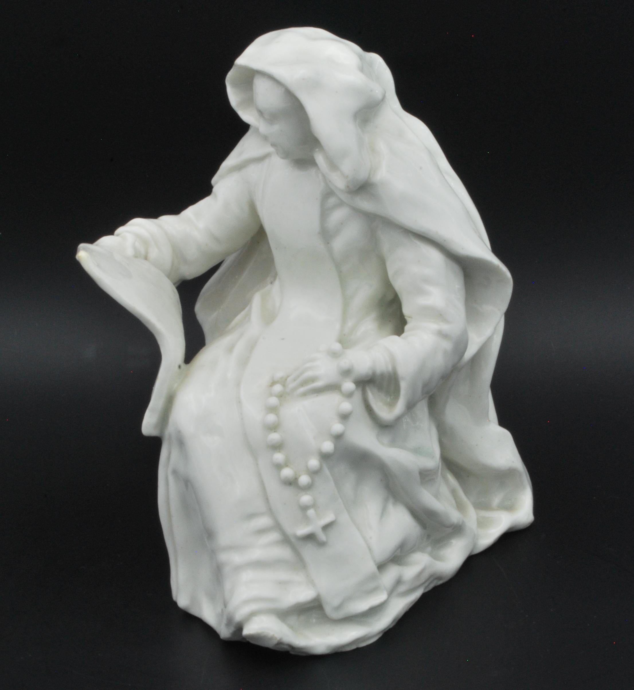 An interesting soft-paste porcelain figure of a Dominican Nun, perhaps the theatrical figure Heloise.

Although the Nun appears in various versions in European and English porcelain, we have not been able to find another in this particular version;