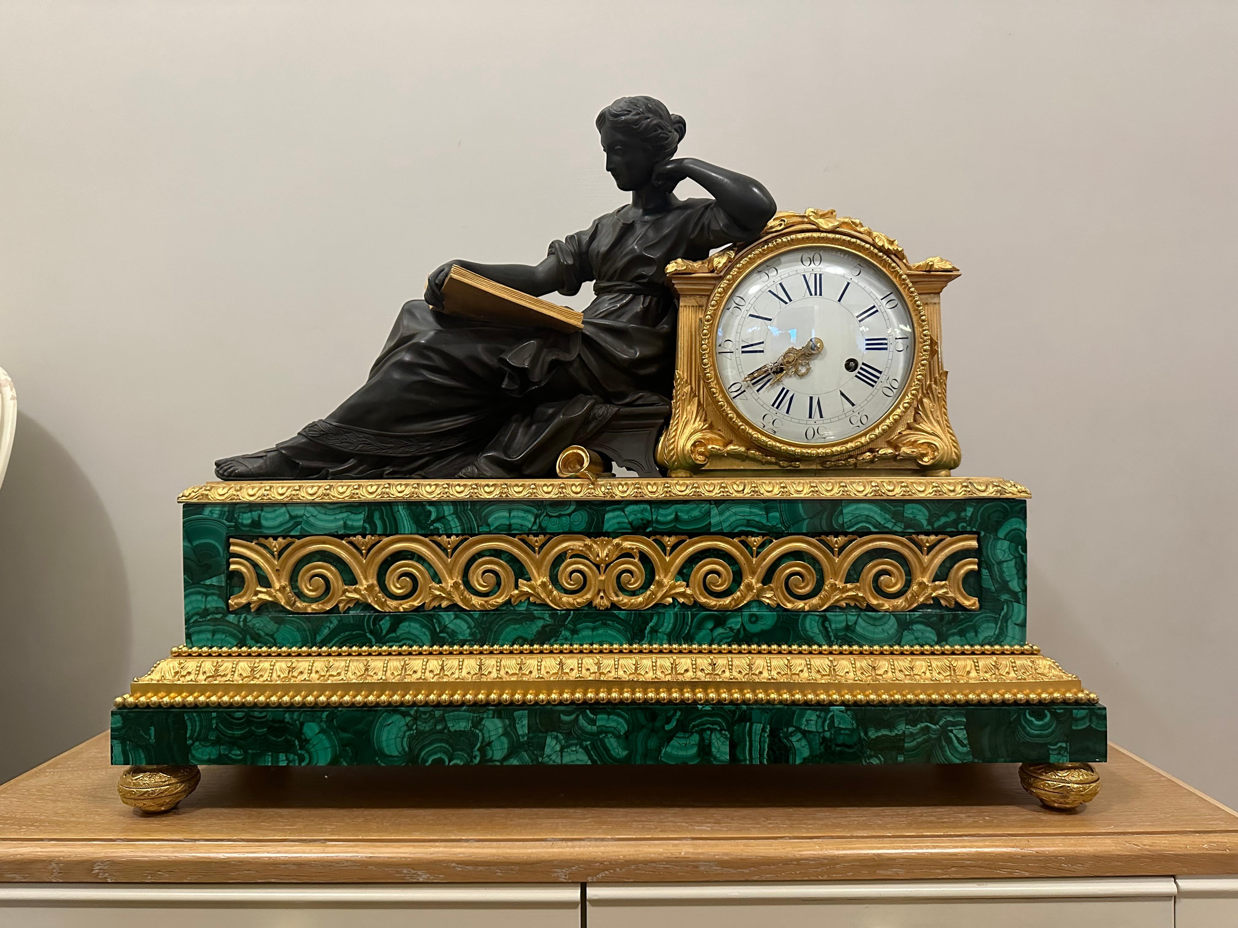Napoleon III “Pendule à la Geoffrin” . A gilded figure representing “The Use of Time” reclines against the clock while reading. The first version of this model was made as early as 1757 for Madame Geoffrin, who had a famous literary salon in Paris