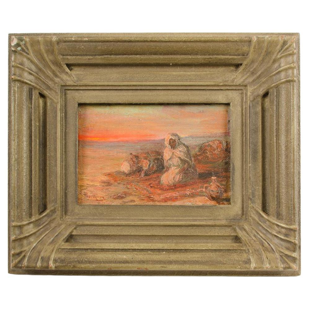 Un dipinto a olio su tavola di uomini beduini sulla spiaggia al tramonto, firmato in modo indistinto.