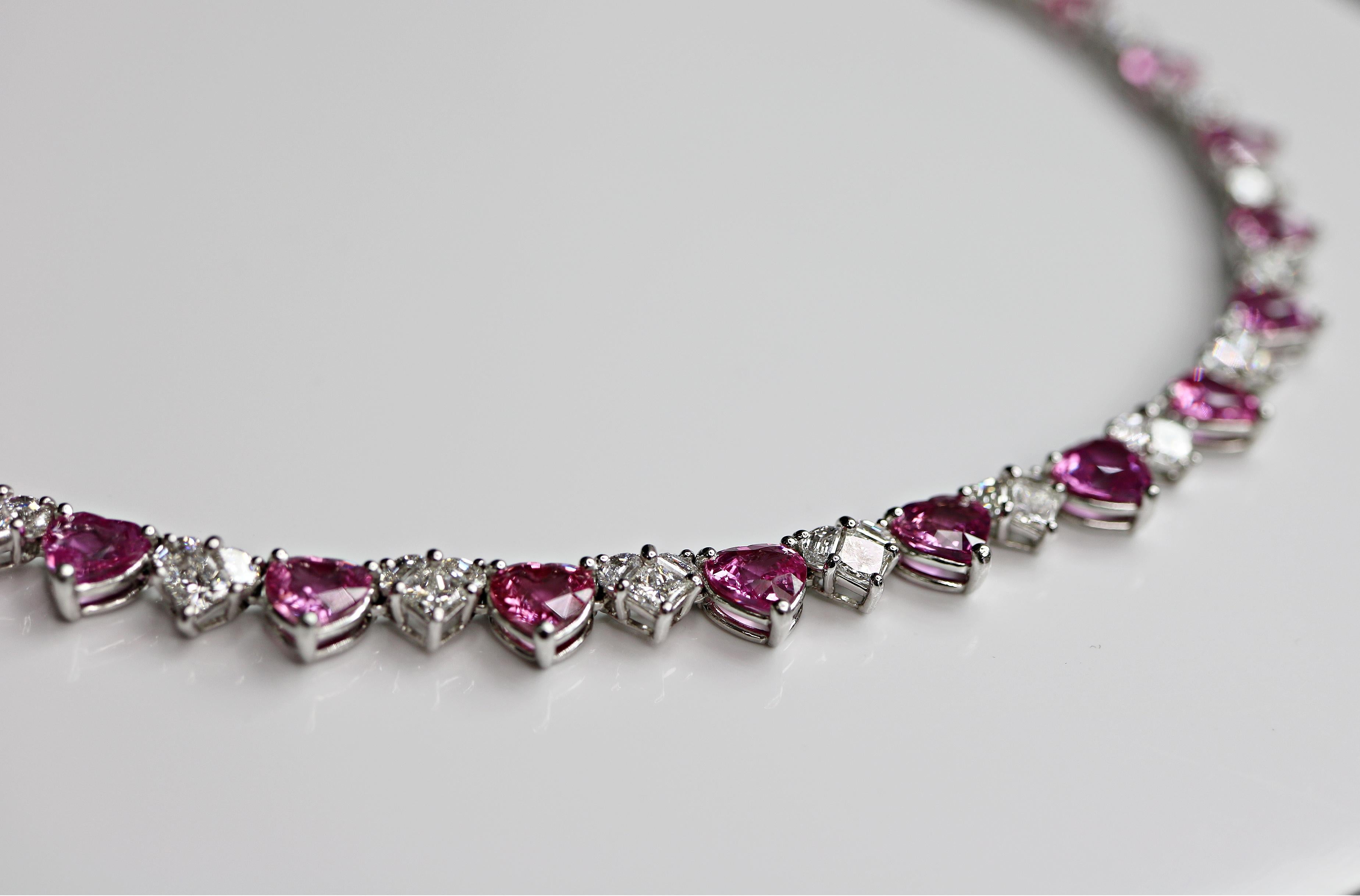 This one-of-a-kind 29.27cttw heart shape Pink Sapphires necklace is set in platinum 
With 13.25cttw heart shape diamonds 