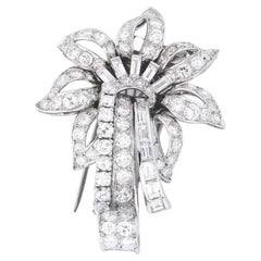 A openworked flower set with Brilliant single cut and baguette diamonds