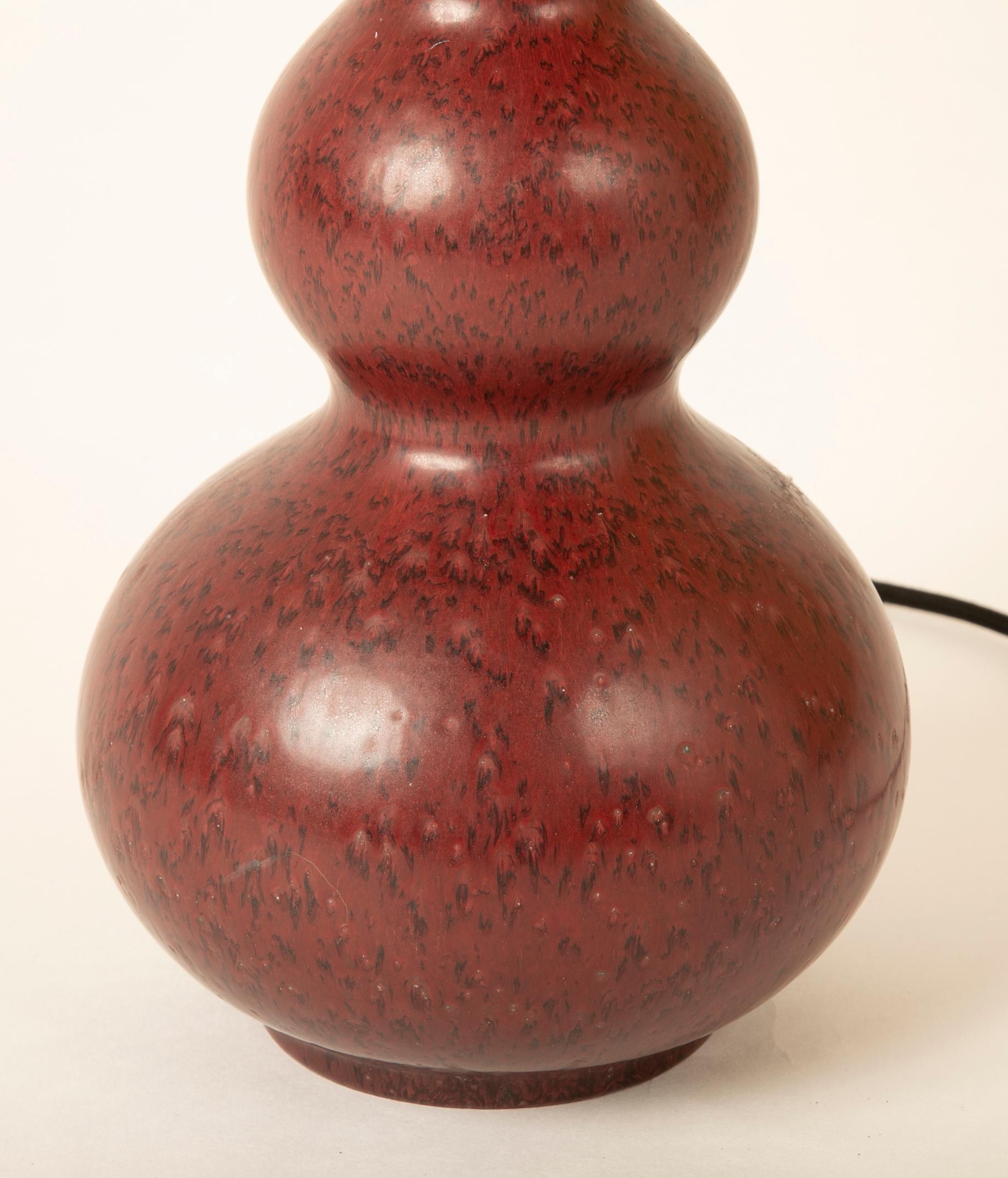 A quadruple gourd form Stoneware lamp designed by Axel Salto in 1944 and produced by between 1969 and 1974. Signed SALTO and marked Royal Copenhagen and impressed 192.51 and numbered in blue 20656.