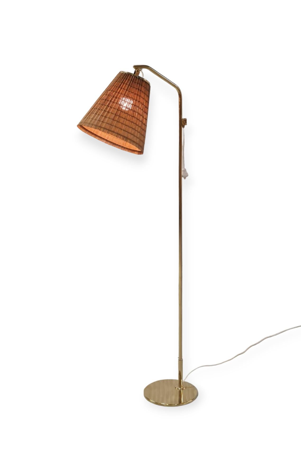 Scandinavian Modern A Paavo Tynell Floor Lamp Model 9613 with Rattan Shade For Sale