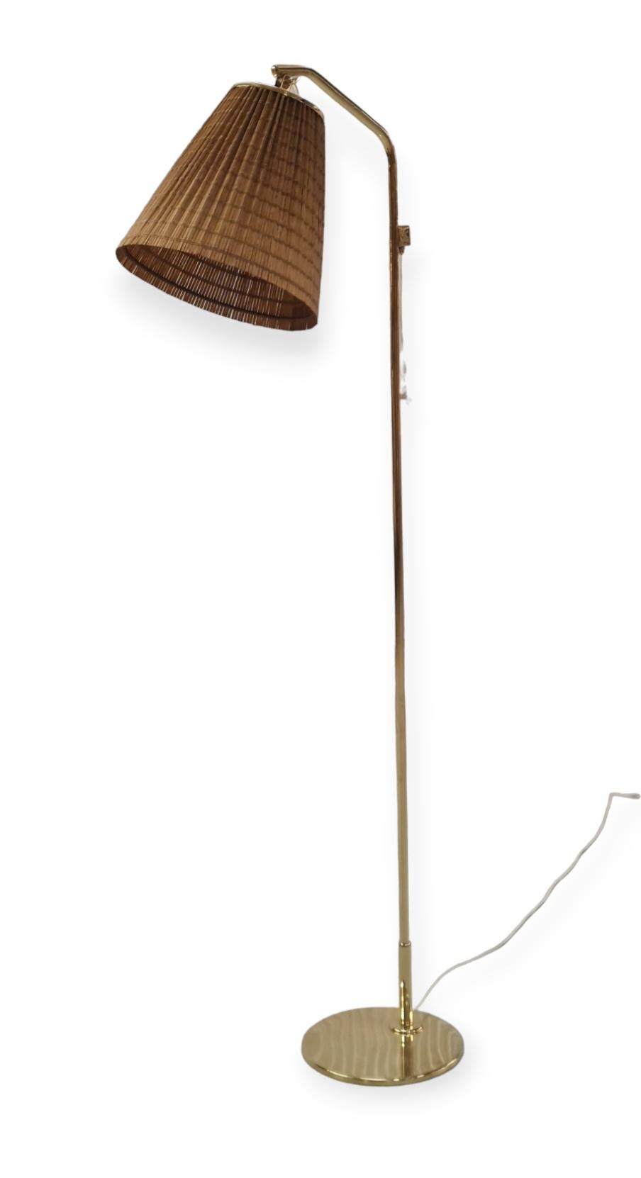 Finnish A Paavo Tynell Floor Lamp Model 9613 with Rattan Shade For Sale