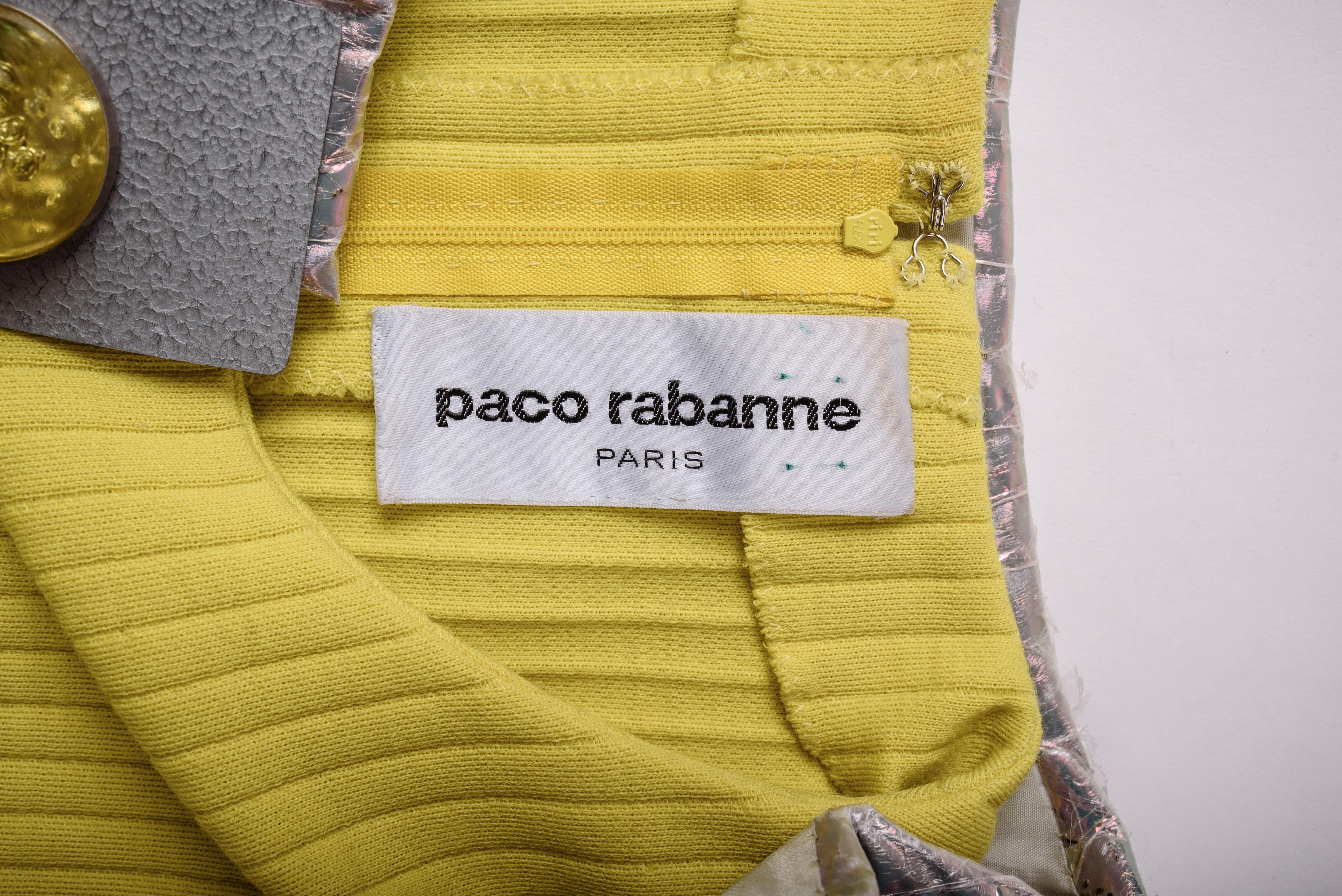 Spring Summer 1991 Collection

France

Modernist ensemble from Paco Rabanne's Haute Couture show. Composed of a pair of Bermuda shorts, a tunic-dress made of stretchy ribbed knitwear in lemon-yellow and a bolero with quilted fins in iridescent