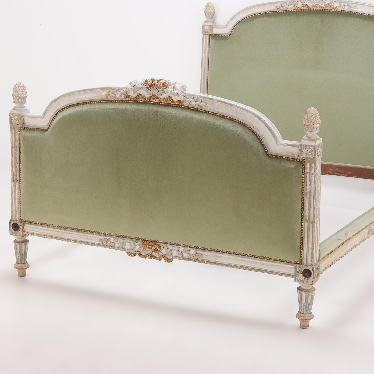 Early 19th Century A painted and carved French Louis XV full size bed circa 1800.