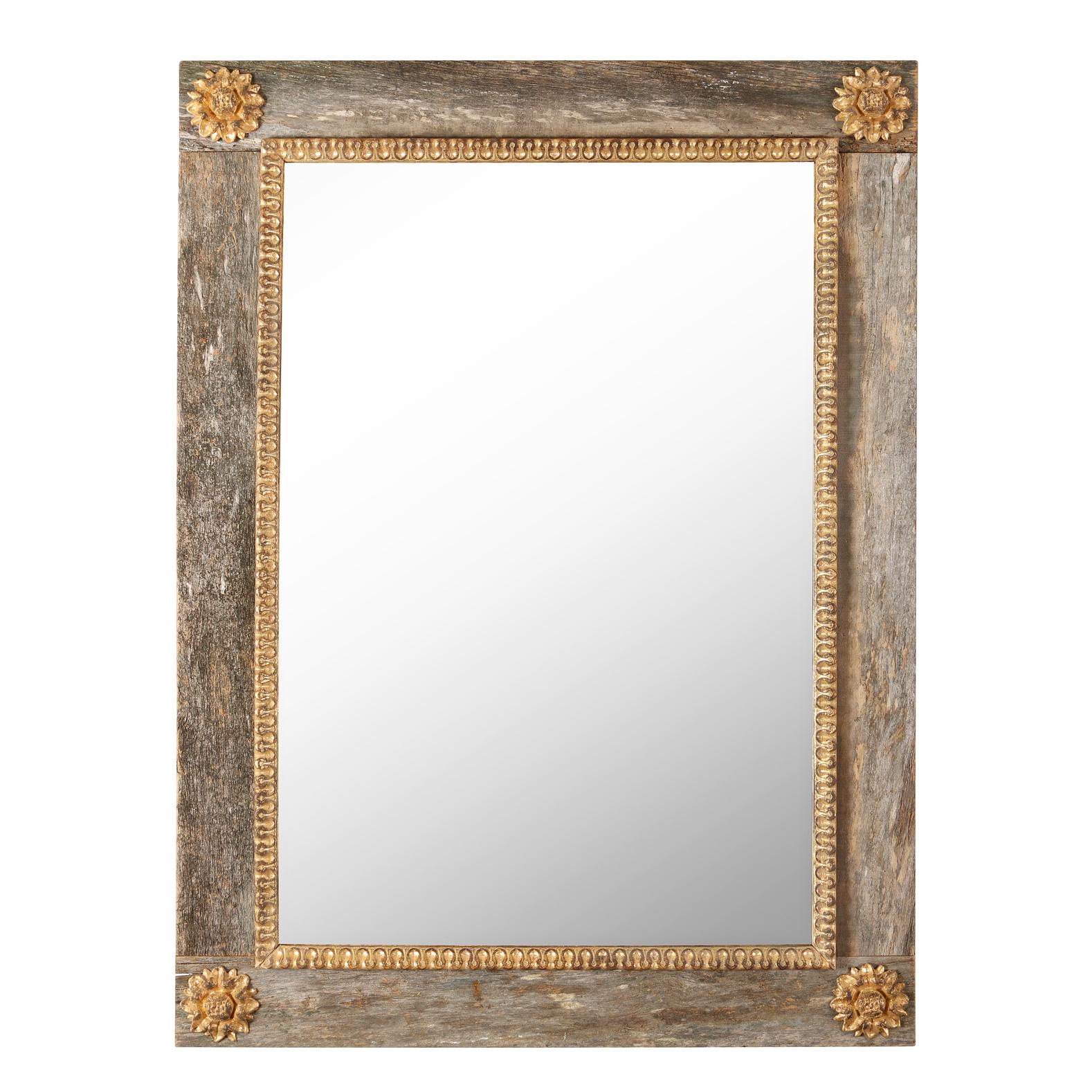 A lovely painted and parcel gilt mirror from France, featuring a frame made with reclaimed wood in a washed finish, and decorated with a gilt beaded molding and rosettes.