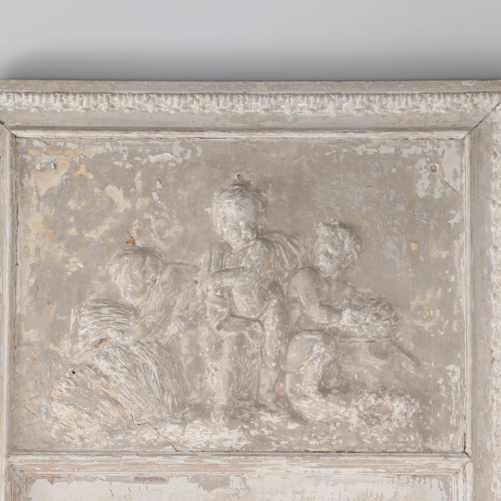 A painted French wall panel with plaster relief having three cherubs circa 1900. Would make a great mirror.
