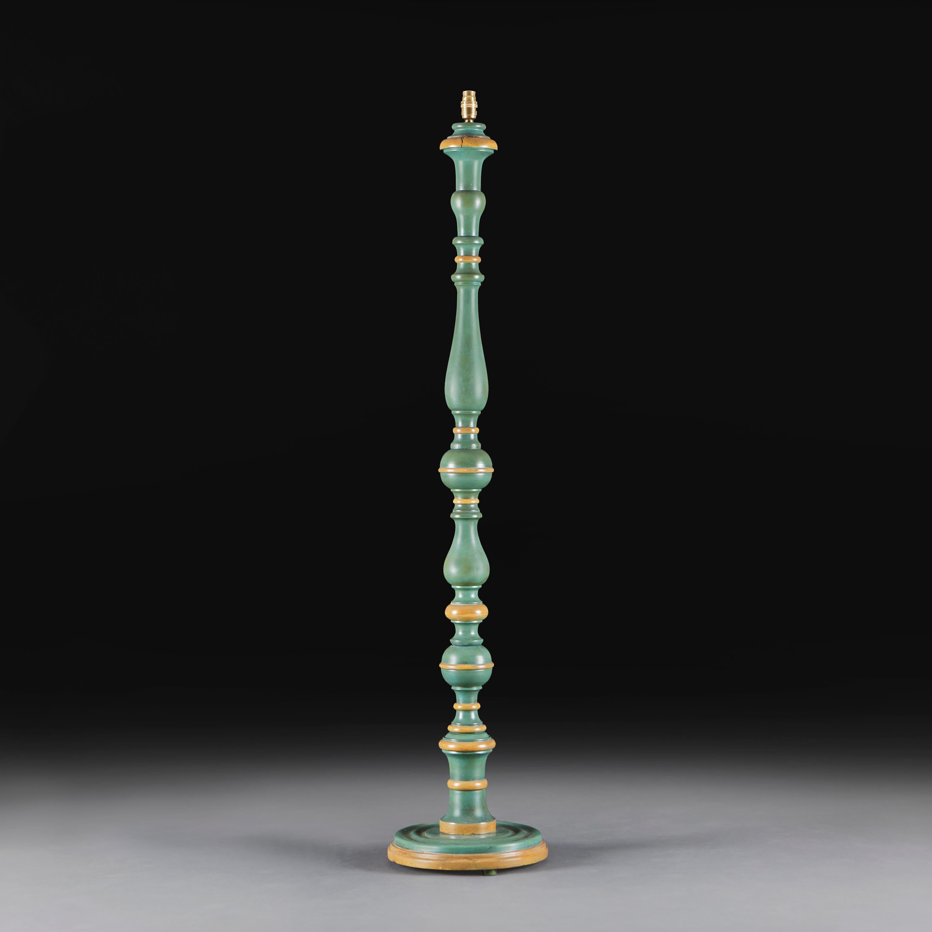Italy, circa 1900

An early twentieth century painted and turned baluster standard lamp, with concentric circles of yellow ochre. The body of muted turquoise, all supported on a turned base.

Height of lamp  141cm
Height with lampshade 