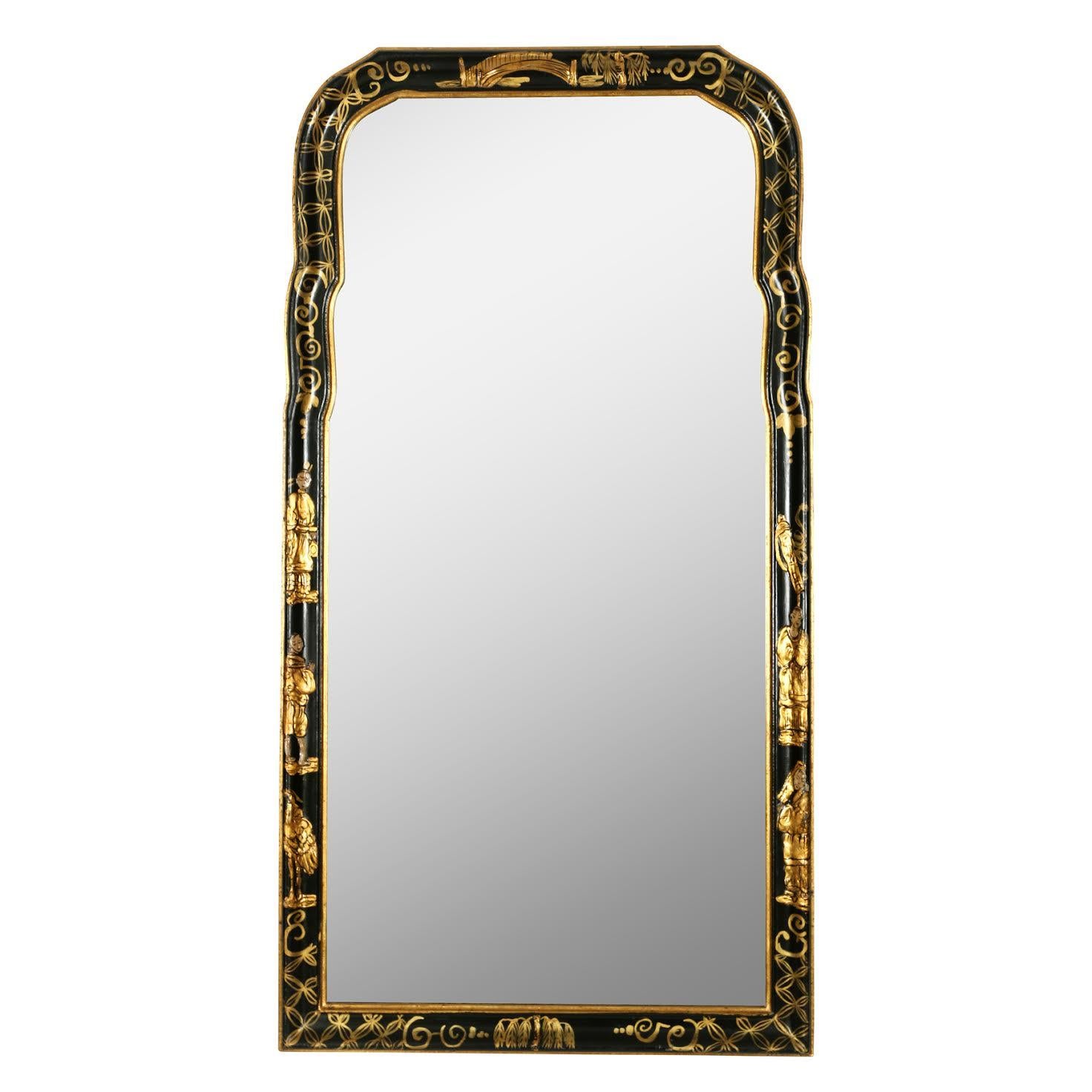 Every home needs a bit of Chinoiserie! This lovely mirror is painted black with gilt trim, hand painted with a Chinoiserie motif. The top is curved, creating an interesting silhouette. A perfect layering piece in any room.