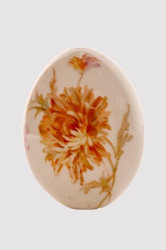 A painted porcelain Easter egg depicting Dahlia flowers, Russia circa 1890.