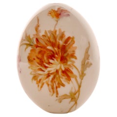 A painted porcelain Easter egg depicting Dahlia flowers, Russia circa 1890.