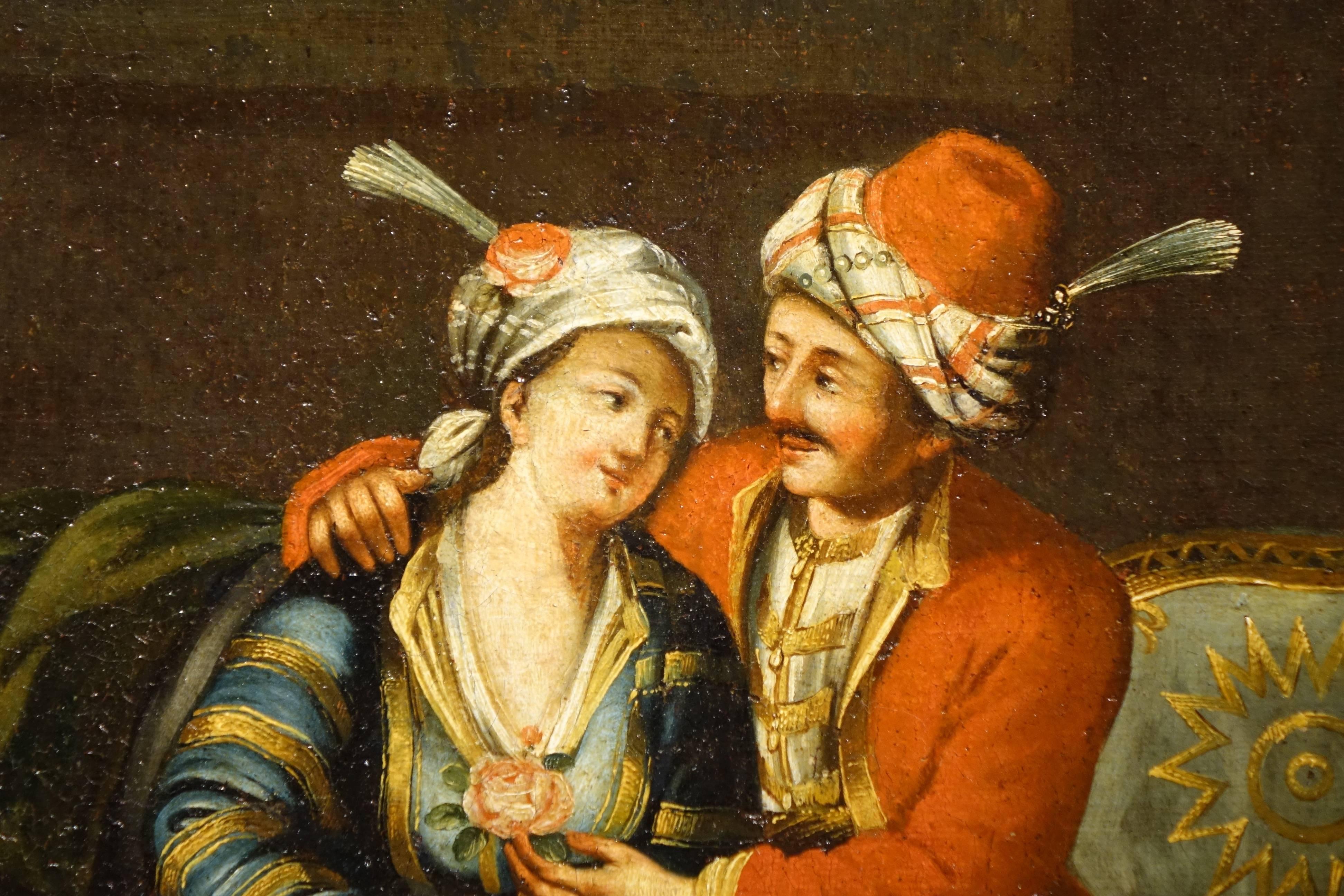  A painting representing a Scene of Courtly Love in an Ottoman interior.
Oil on canvas 
Charming scene of a French Orientalist school from the mid-19th century.
A lord (Pasha or general) offers a rose to a young woman in an interior decorated with