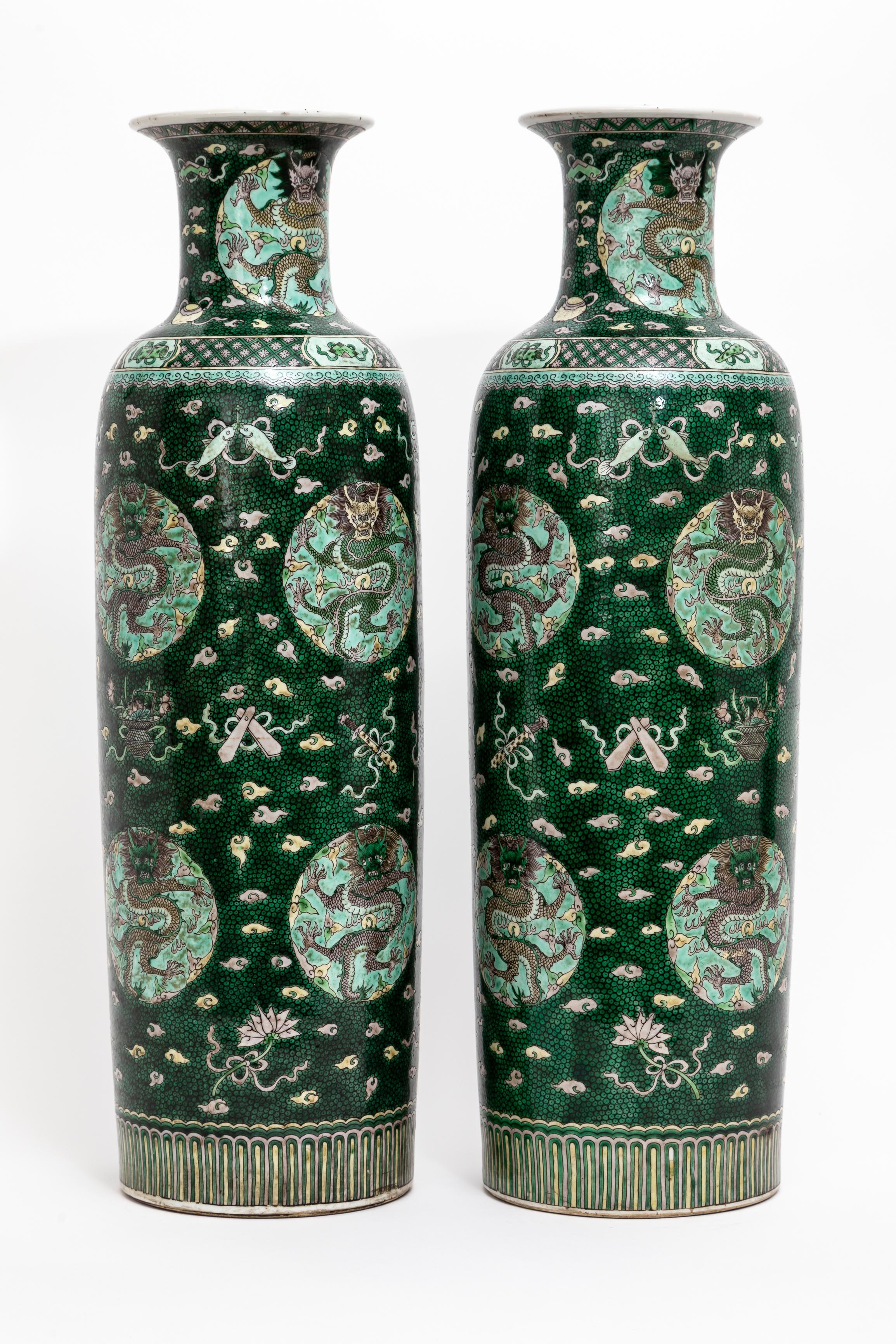 A Large and Highly Rare Pair of 18th Century Chinese Kangxi Porcelain Sleeve Form Famille Verte and Fish-Roe Ground Five-Claw Imperial Motif Dragon Vases.  Of slender Sleeve form with flared open rim, which extends down a waisted neck to a
