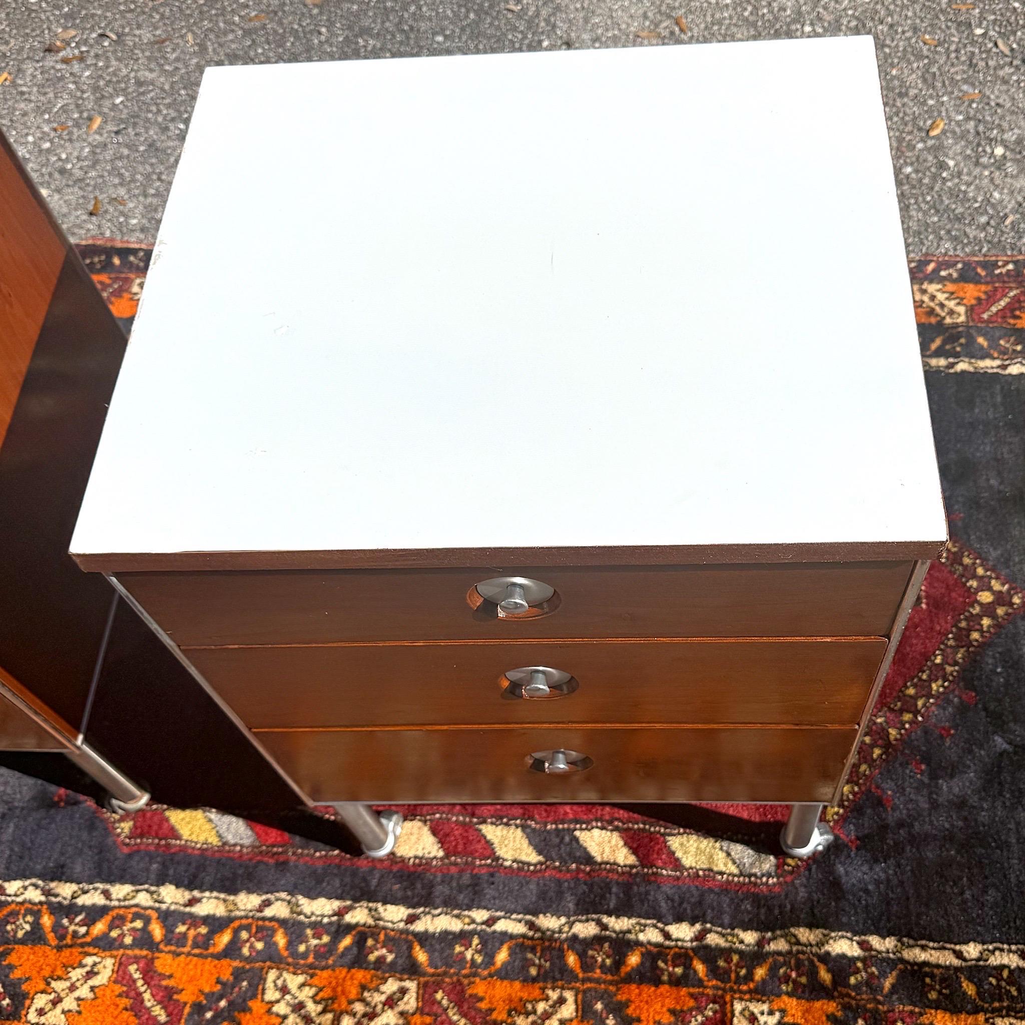 1950s Mid-Century Raymond Loewy for Hill Rom Industrial Rolling 3 Drawer Nightstands or End Tables - a Pair

A newly refinished striking pair of midcentury rolling cabinets by important Industrial designer Raymond Loewy (American, 1893-1986) for