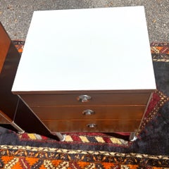 A pair 1950s Raymond Loewy Industrial Rolling 3 Drawer Nightstands or End Tables