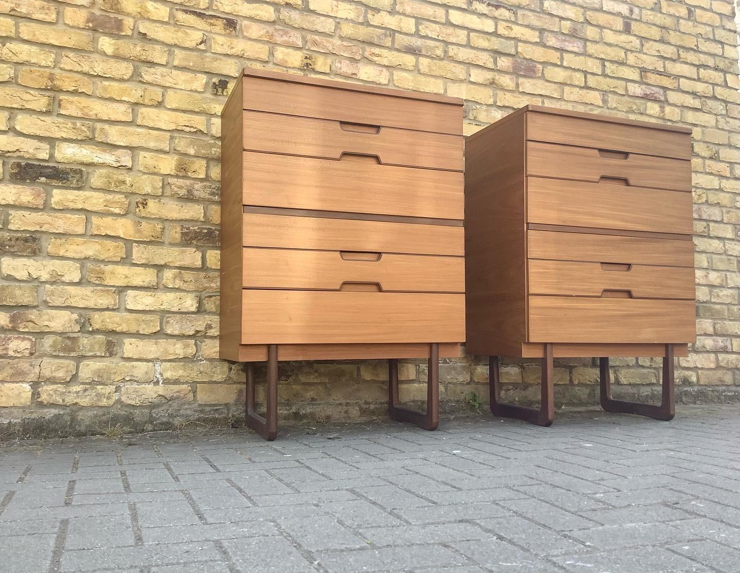 Superb rare pair of 1960s Danish inspired tallboy chest of drawers designed by Gunther Hoffstead for Uniflex of Great Britain as part of the ’Q’ series. This unit features 6 different sized drawers with smart recessed handles and sleigh legs,
