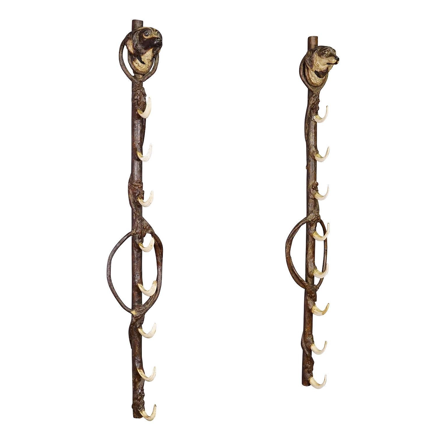 A Pair Antique Black Forest Gun Holders, Austria late 19th Century

An antique pair of Black Forest gun holders mounted side by side on the wall. They consist of a wooden rod covered with resin decorations depicting oak leaves. The rifles are held