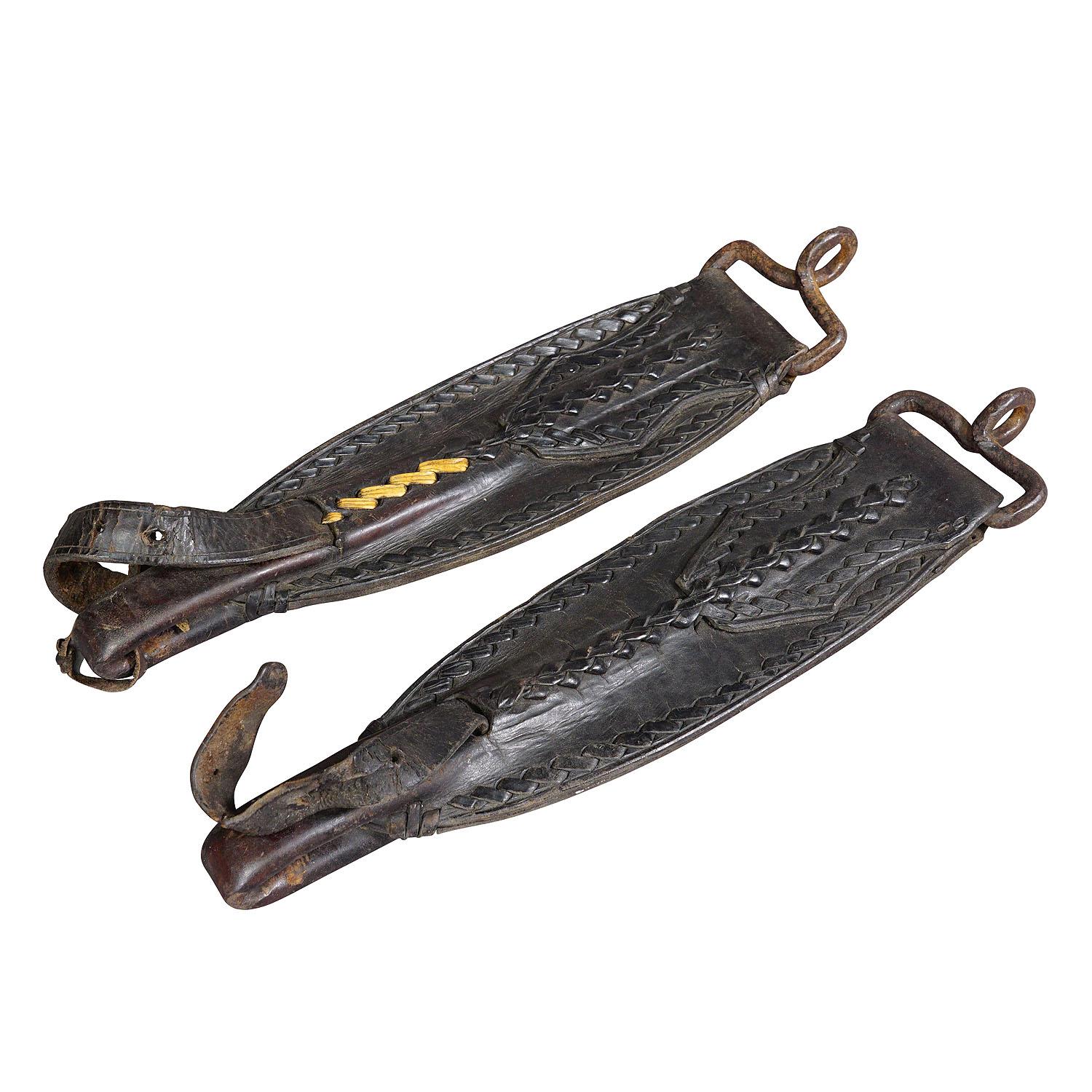 A Pair Antique Leather Stirrup Holders

A pair antique leather stirrup holders. Handmade in the first half of the 20th century. Good condition with traces of use, one with old repair. This authentic antique piece is a great home decoration and