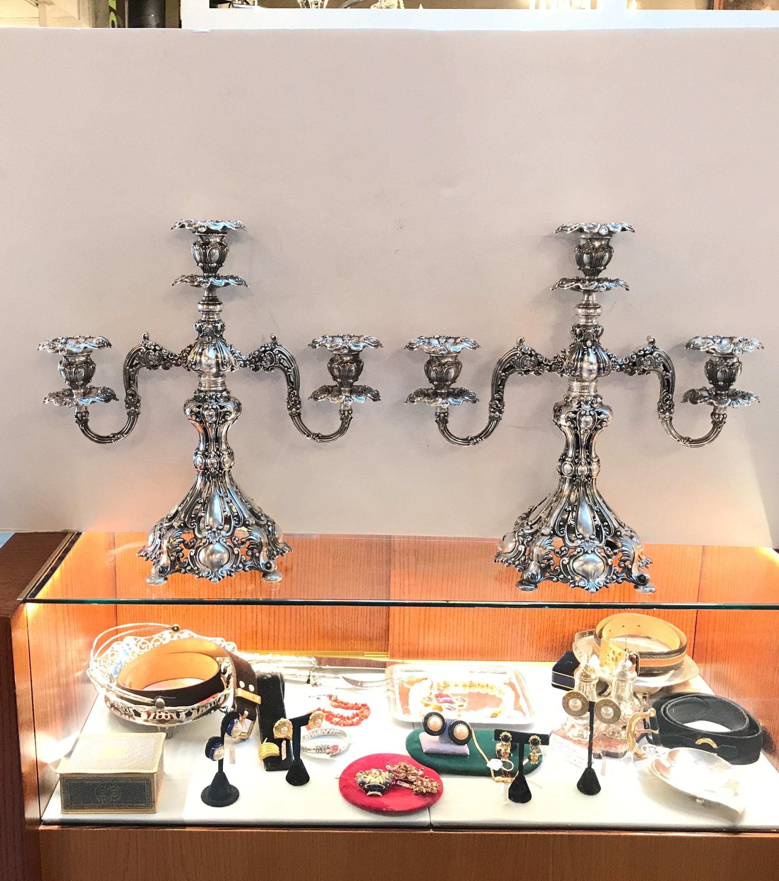 A pair of three light Baroque style silver plate candelabra. Elaborate and ornate 
