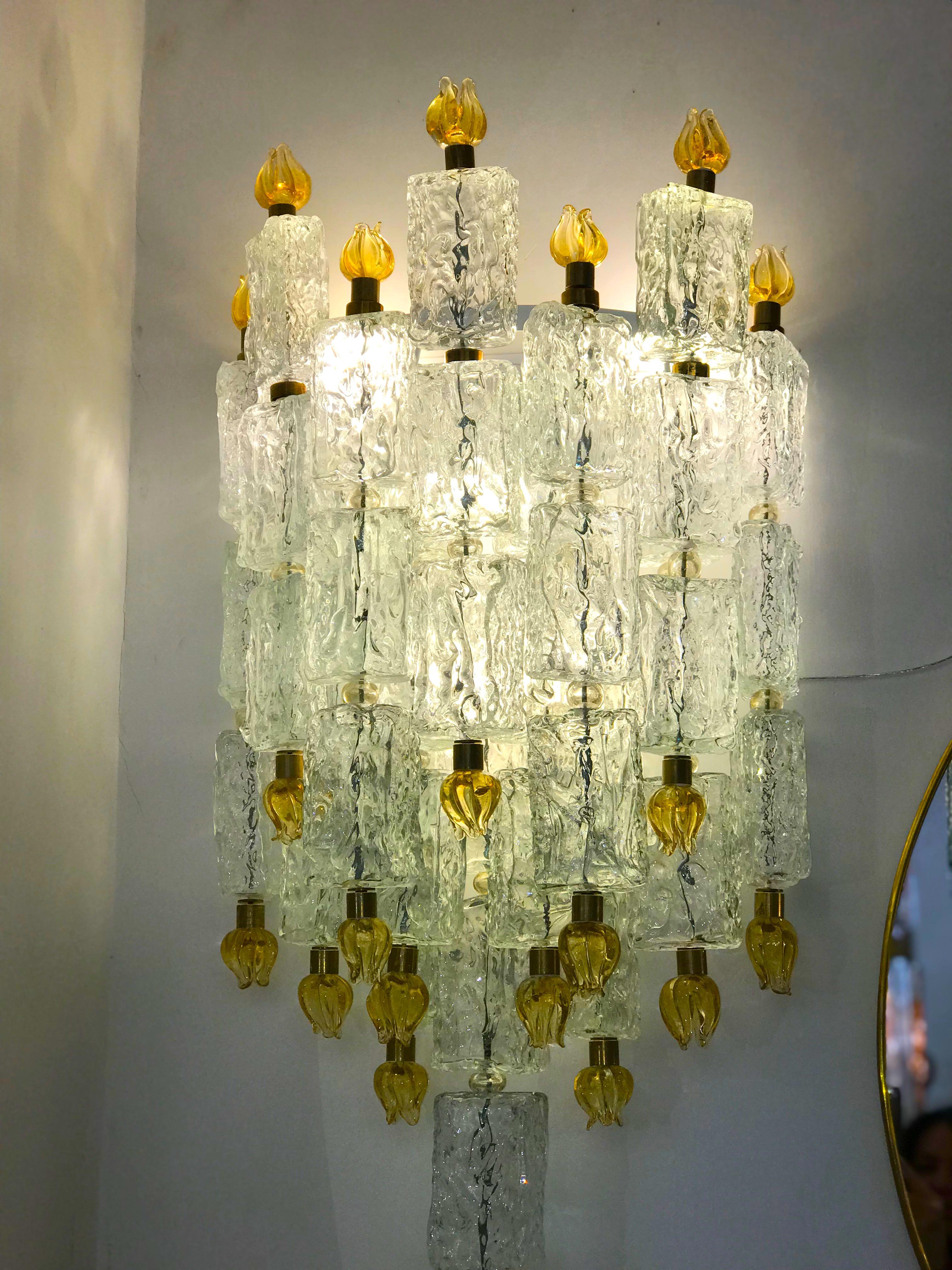 Outstanding pair of Barovier sconces with glass blocks ending with delicious hand blown gold tulips.
We have 2 pairs and available also a magnificent chandelier from the same provenance.
Provenance from a Luxurious Tuscany Hotel.

 