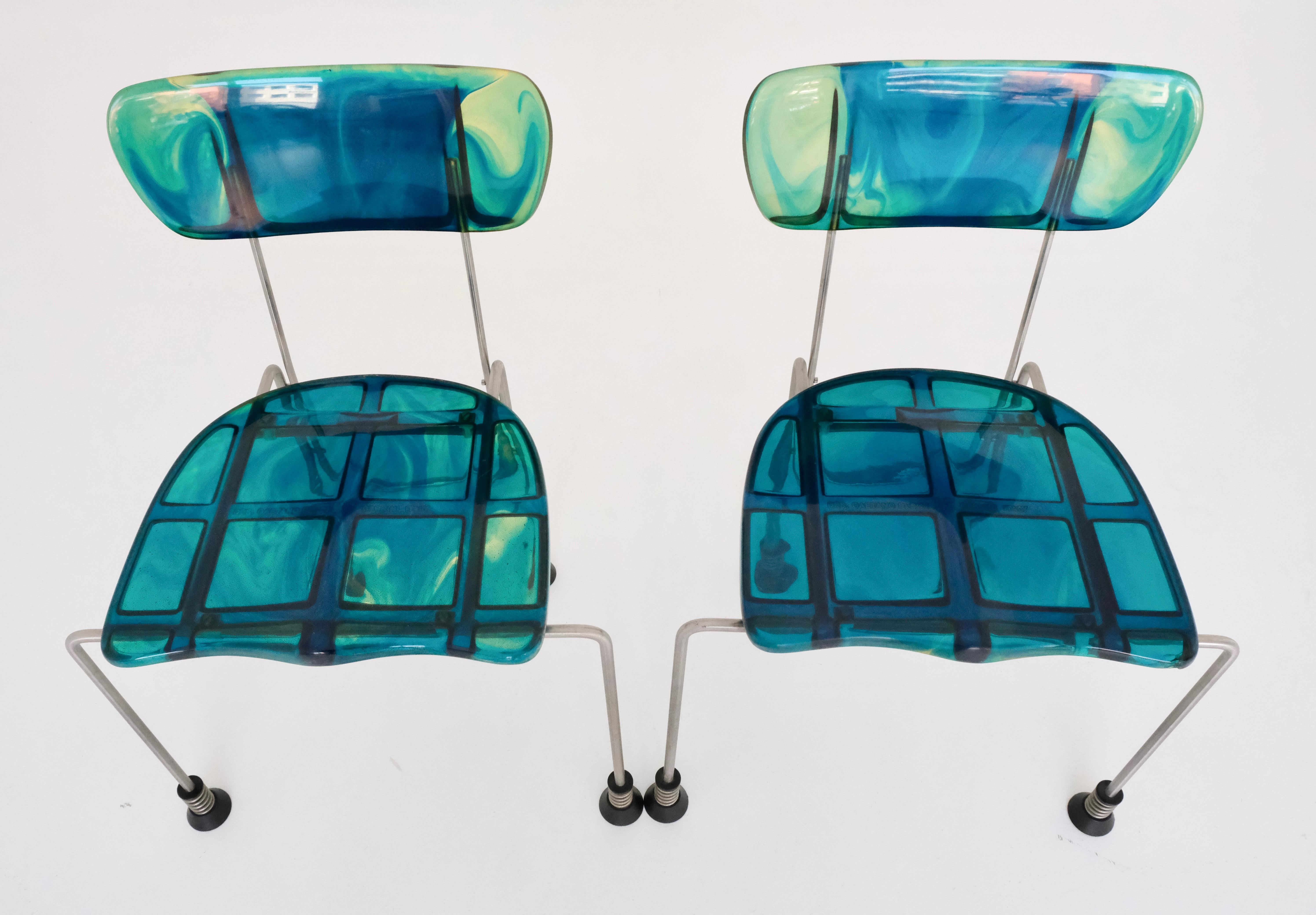 A very rare pair of ‚broadway‘ chairs by Gaetano Pesce for Italian company Bernini, 1993.

Multicolored cast epoxy resin (mainly blue and green), brushed steel legs, spring and rubber-capped feet. All chairs signed with cast manufacturer’s mark