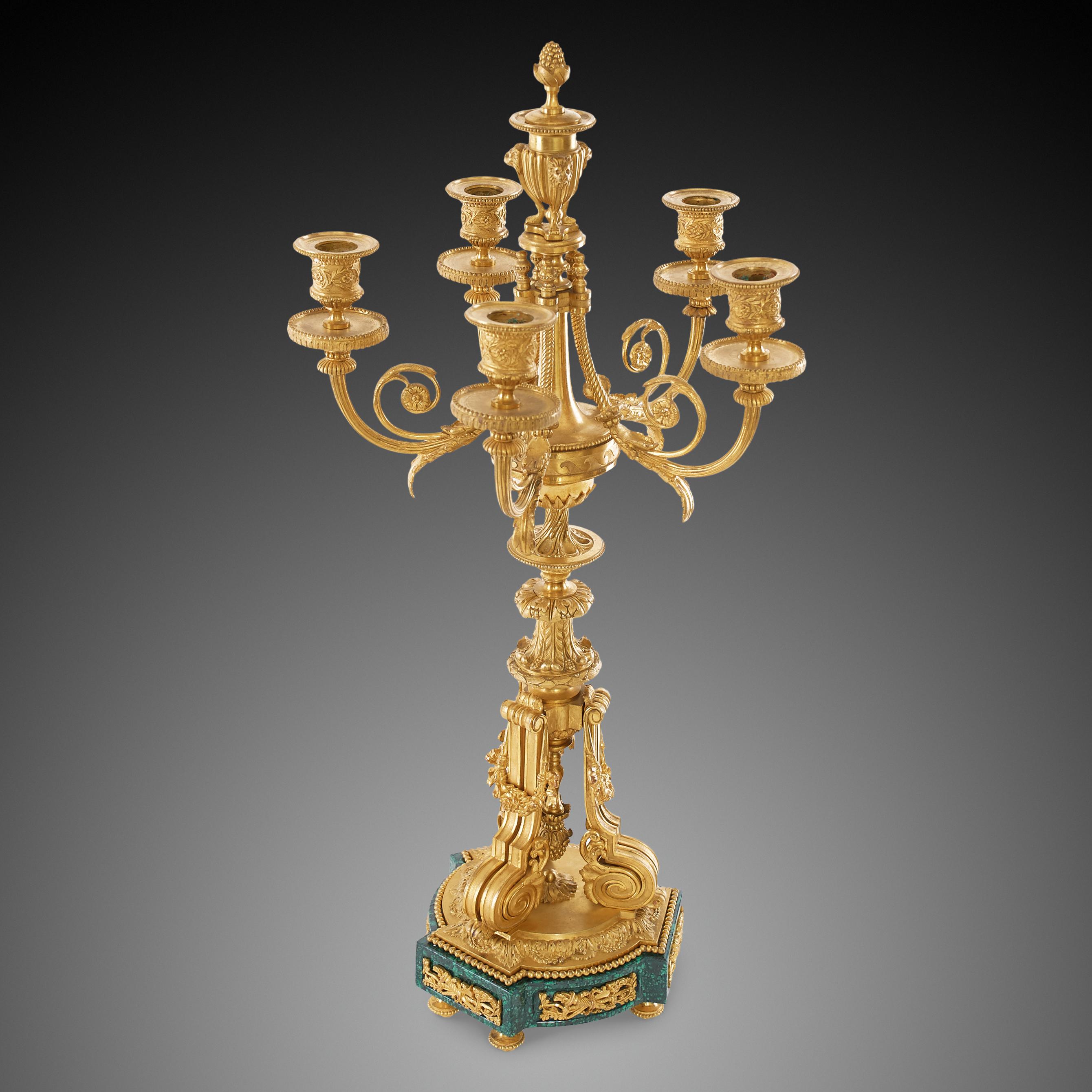 This pair are fine examples of the Louis XVI style.Five arm candlesticks finished with precision and craftsmanship. The brackets support the richly adorned lamp-form ormolu body of the candelabrum.The base is made of beautiful malachite with a