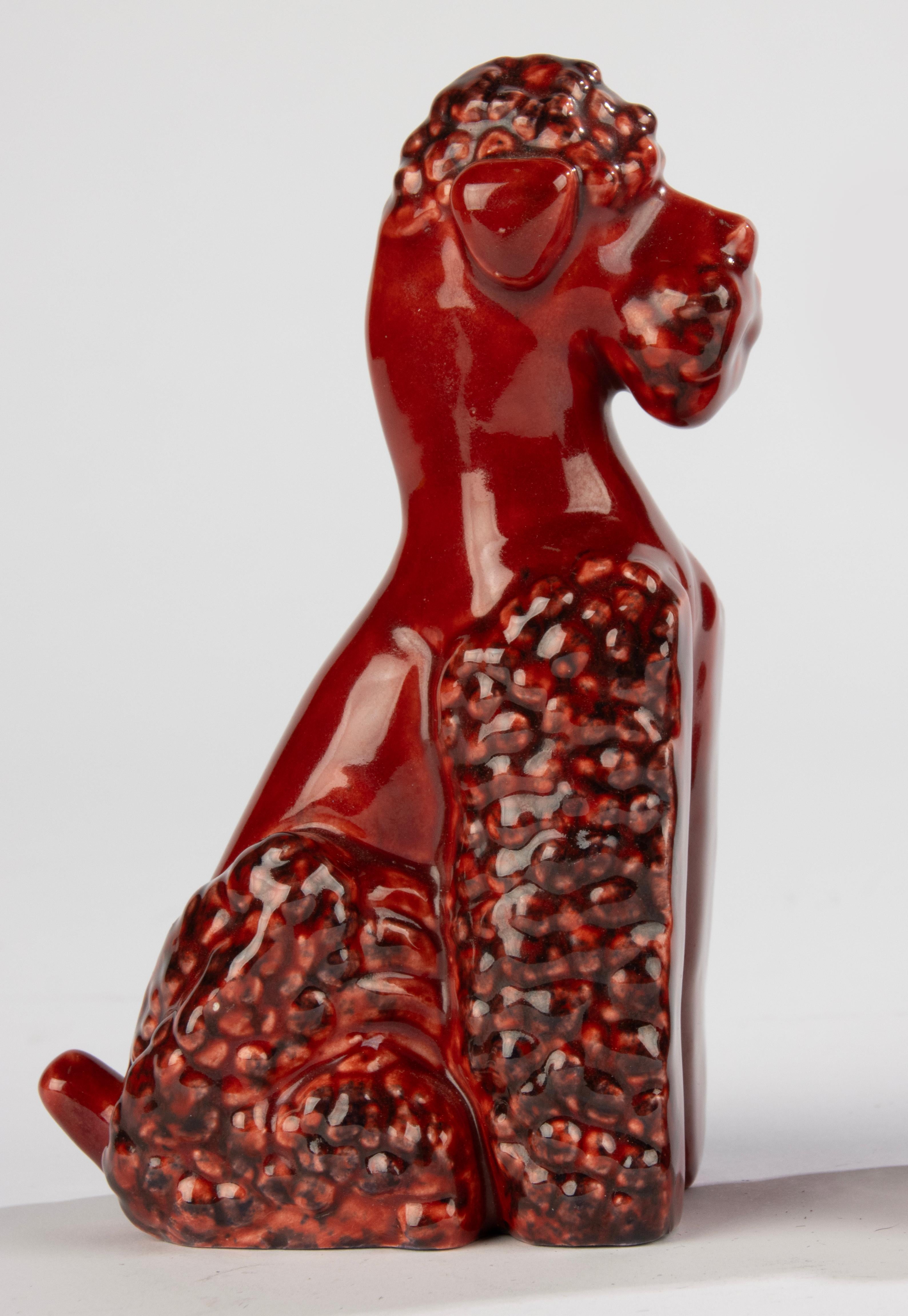 A beautiful set of ceramic bookends, made by the French brand Sèvres, designed by Paul Milet.
The bookends are images of poodles, very nice and expressive, made in the typical red color, which is characteristic of the ceramics of Paul Milet.
Both