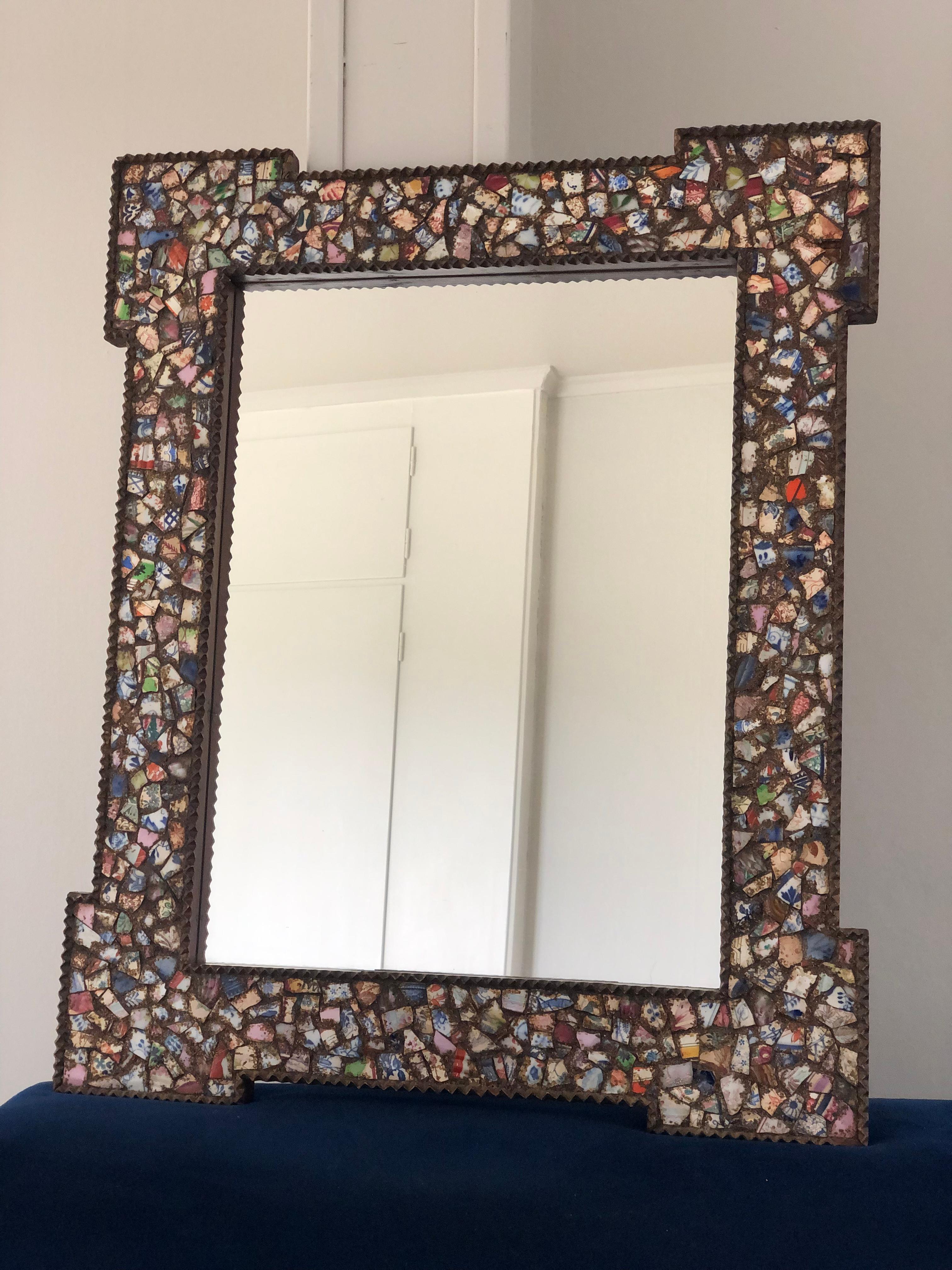A pair handcrafted mirrors decorated with broken crockery. The colorful mosaic mirrors are decorated with all kinds of crockery and filled with gilt. The wooden edge of the frame has been carved.

Beautifully handmade and richly decorated mirror In
