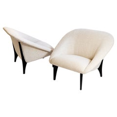 A pair cream fabric «Lido» armchairs by Arne Norell for Westbergs Möbler AB
