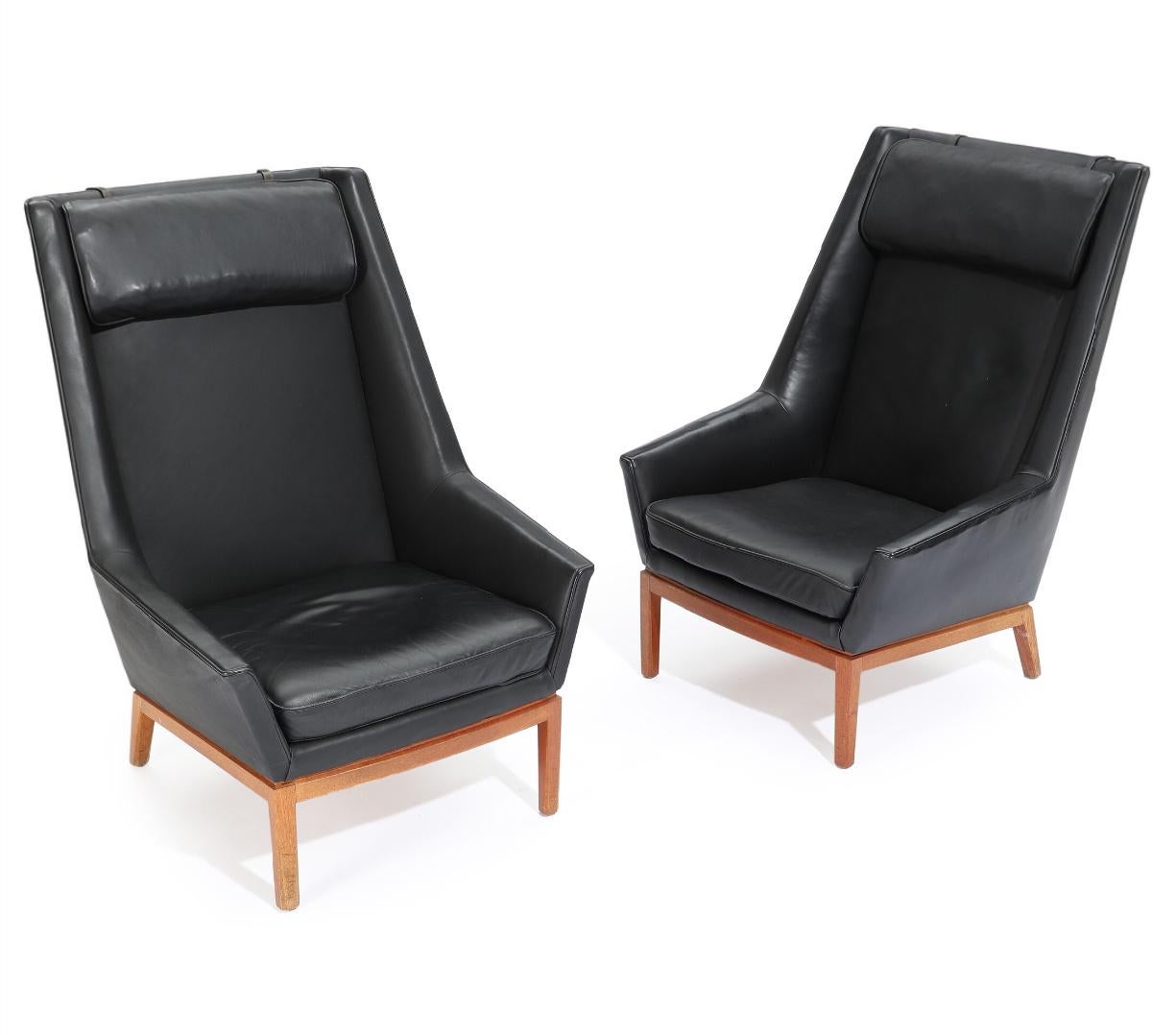 Erik Kolling Andersen (b. 1921)
Danish highback easy chairs with teak frame. Sides, back and loose seat cushion upholstered with black leather. Designed 1954. Made by cabinetmaker Peder Pedersen, with maker's label.
Provenance: Director Christian