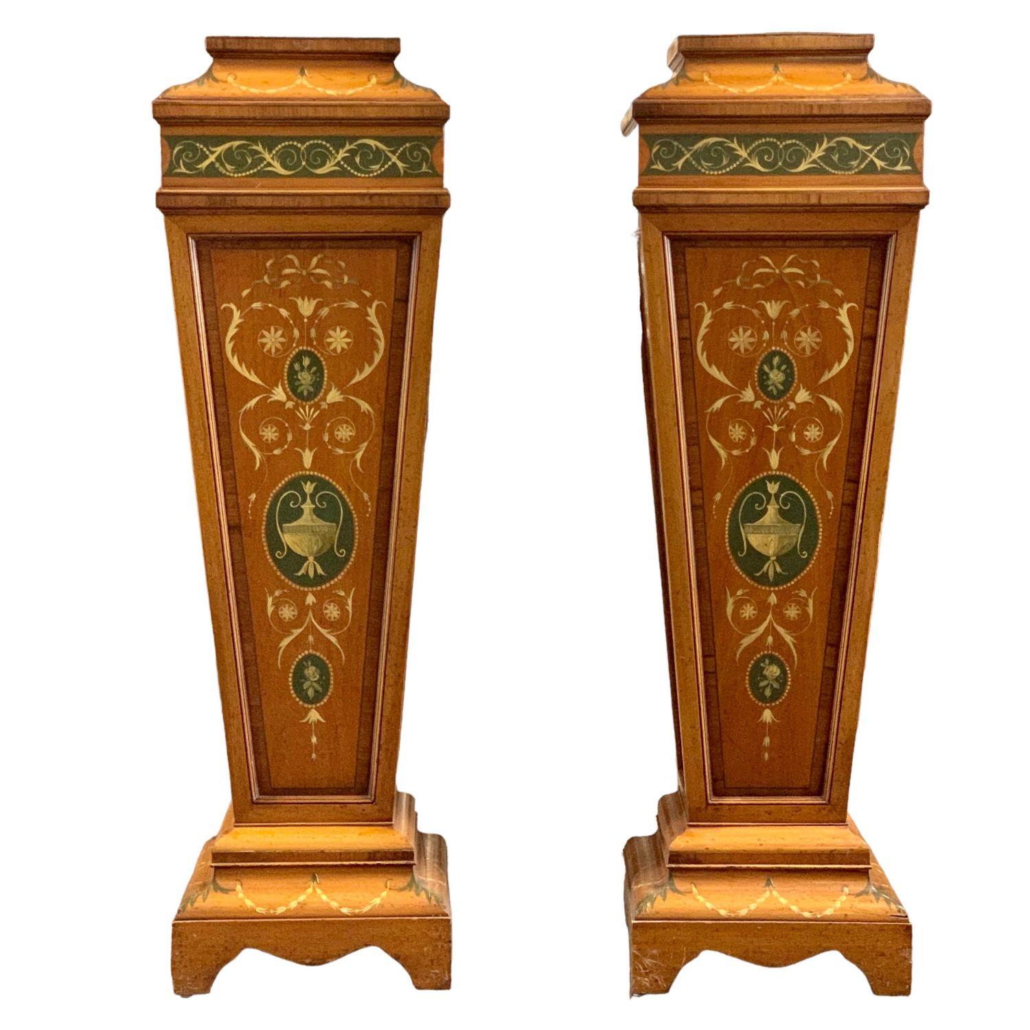The quality pedestals with highly figured satinwood, and finely detailed painting suggests the production of a top London cabinet-maker.
English Edwardian period Satinwood pedestals with cross banding and original floral hand painted decoration to