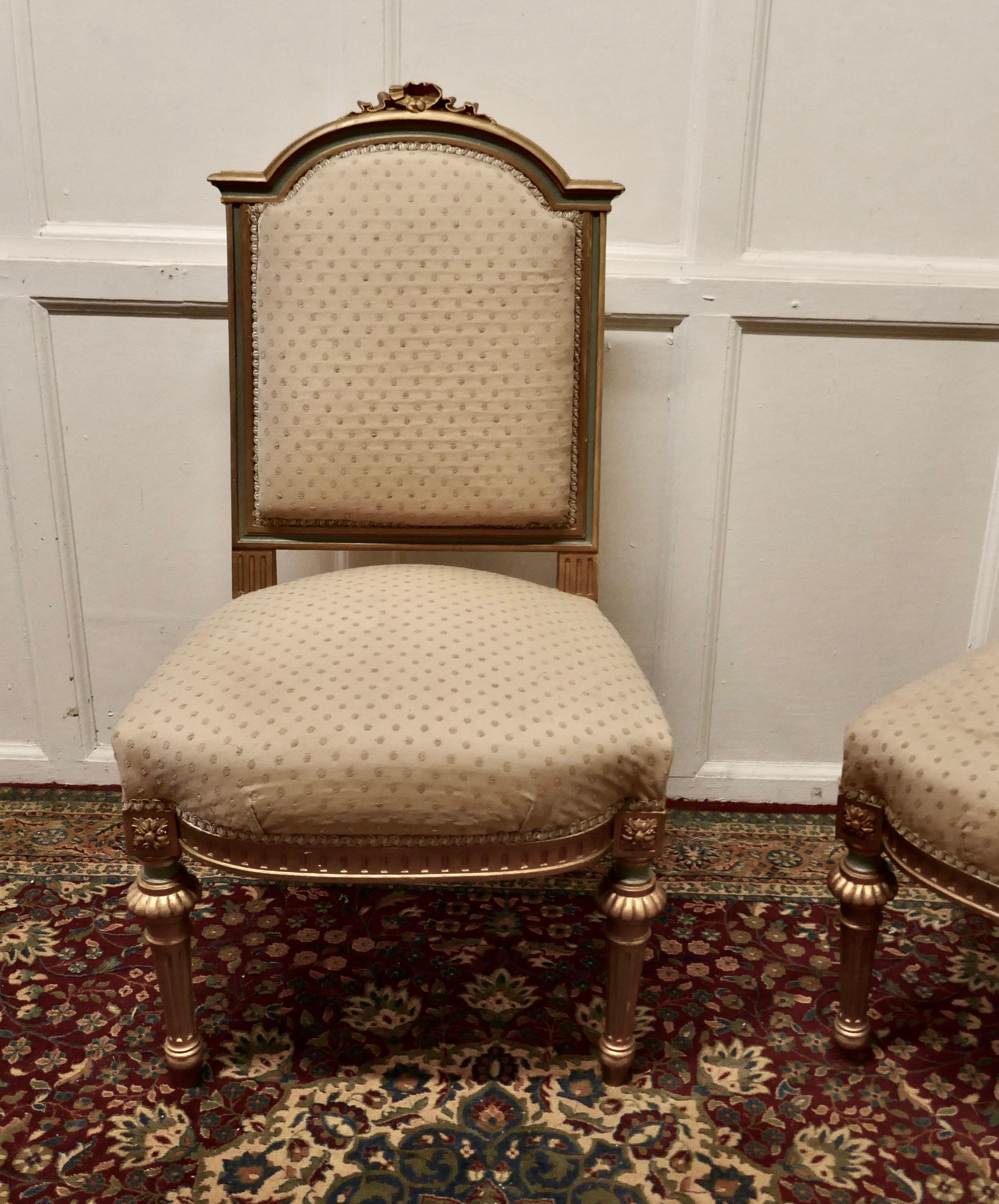 A pair fine quality French gilt salon chairs circa 1880
 
Old world faded elegance a pair of French salon chairs in the Louis XVI style, the chairs are in original gilt and powder blue finish they come in their original oatmeal coloured silk