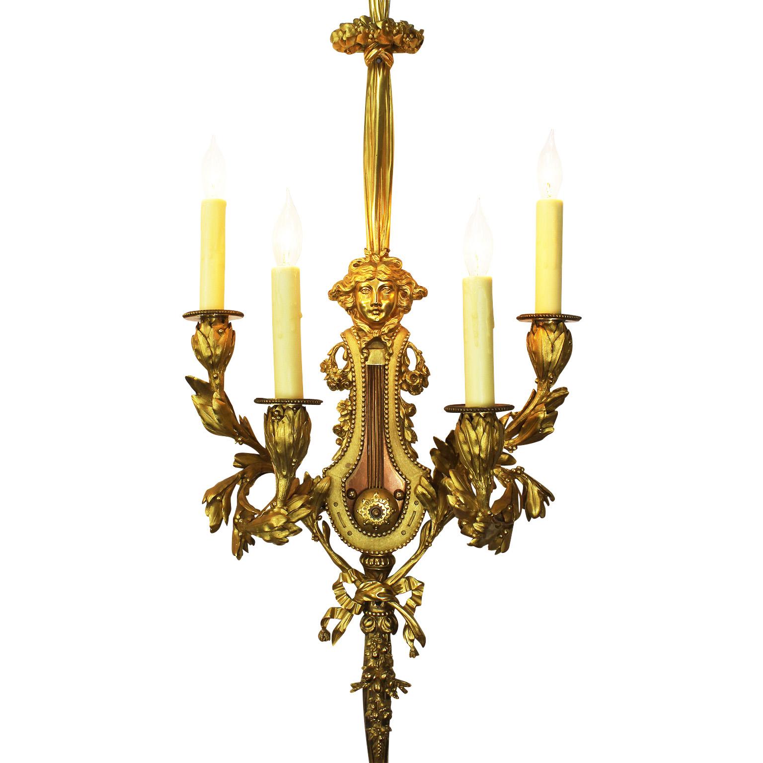 A Very Fine Pair of French 19th Century Louis XVI Style Gilt-Bronze Four-Light Wall Appliques (Wall lights - Wall sconces) after the model by Pierre Gouthière (French, 1732–1813) attributed to Henry Dasson (French, 1925-1896). One wall light