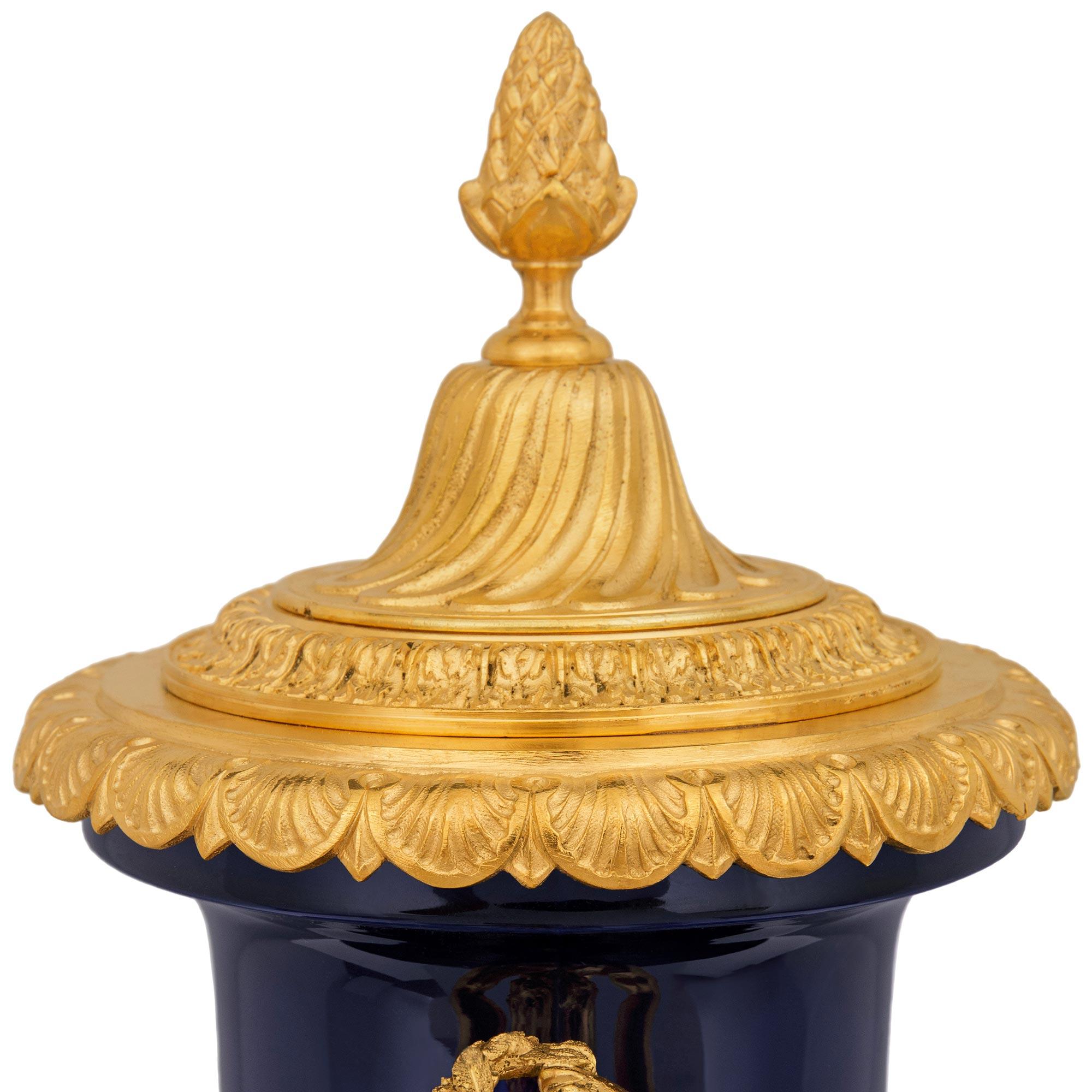 A pair French 19th century Louis XVI st. Sévres Porcelain and Ormolu urns For Sale 1