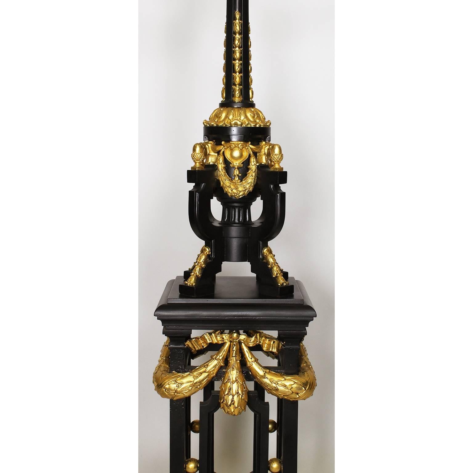 Cast Pair French 19th-20th Century Neoclassical Style Iron and Parcel-Gilt Torcheres  For Sale